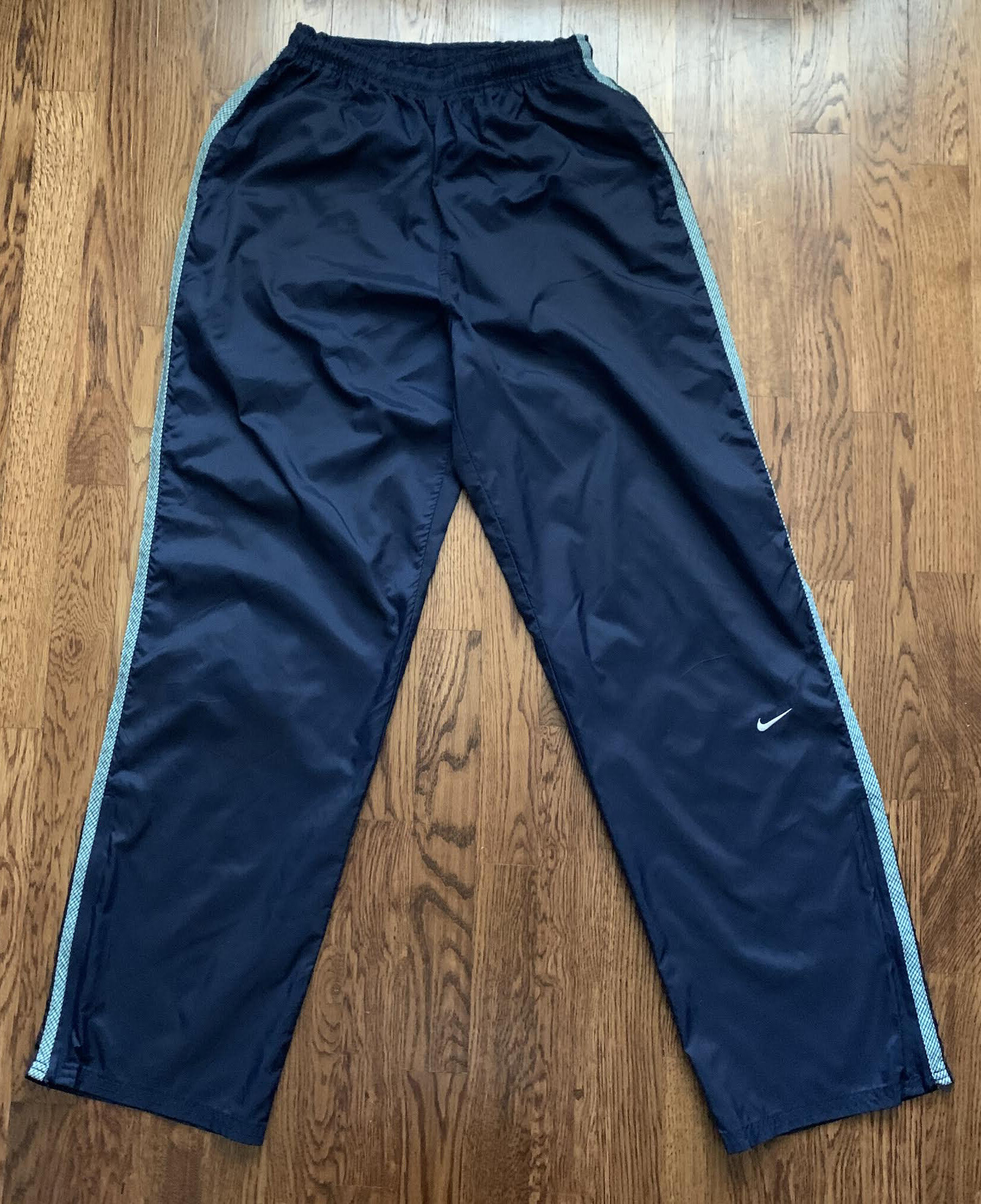 navy blue nike windbreaker pants