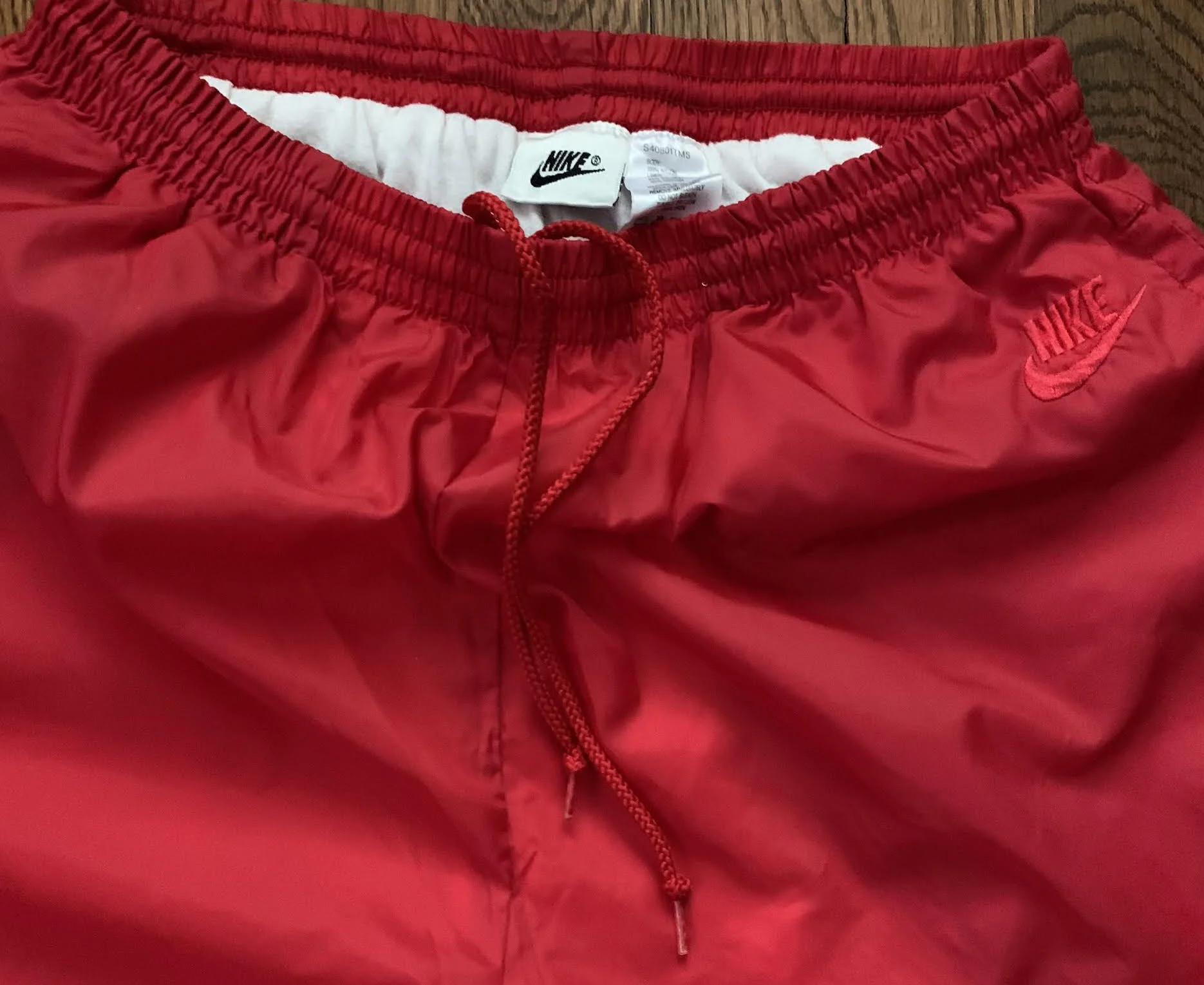 Vintage 90s Nike Swoosh Red Windbreaker pants.
