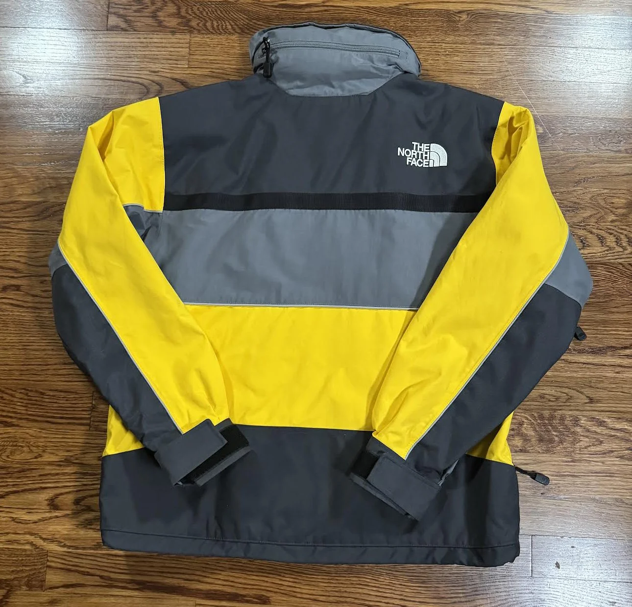 back of steep tech yellow jacket.jpg