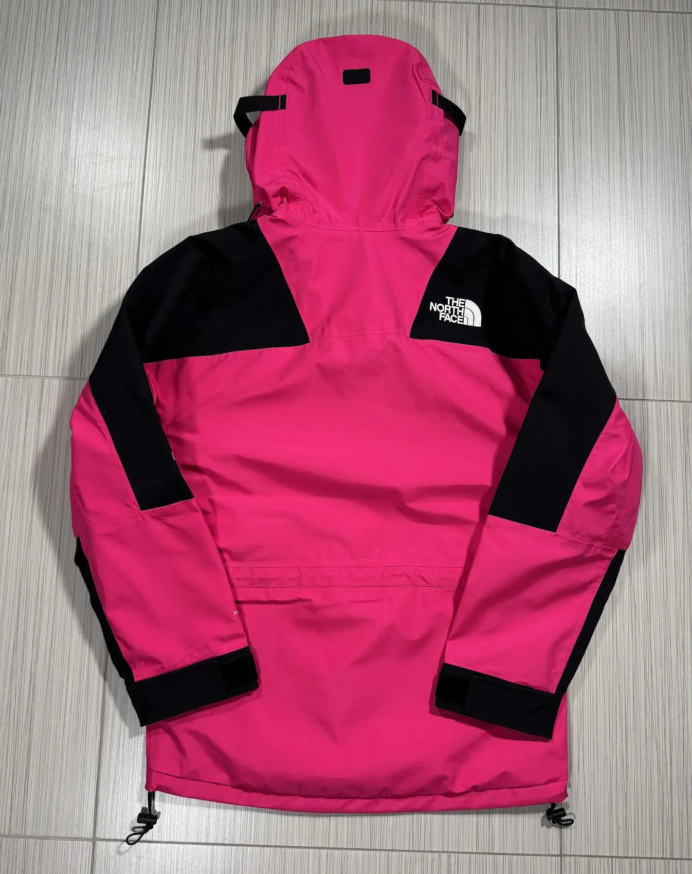 Back of TNF Mr Pink Mt Light Jacket.jpg