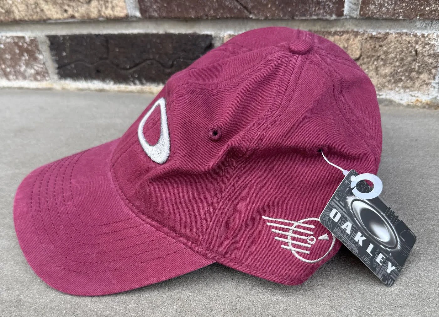 side of Oakley Burgundy hat.jpg