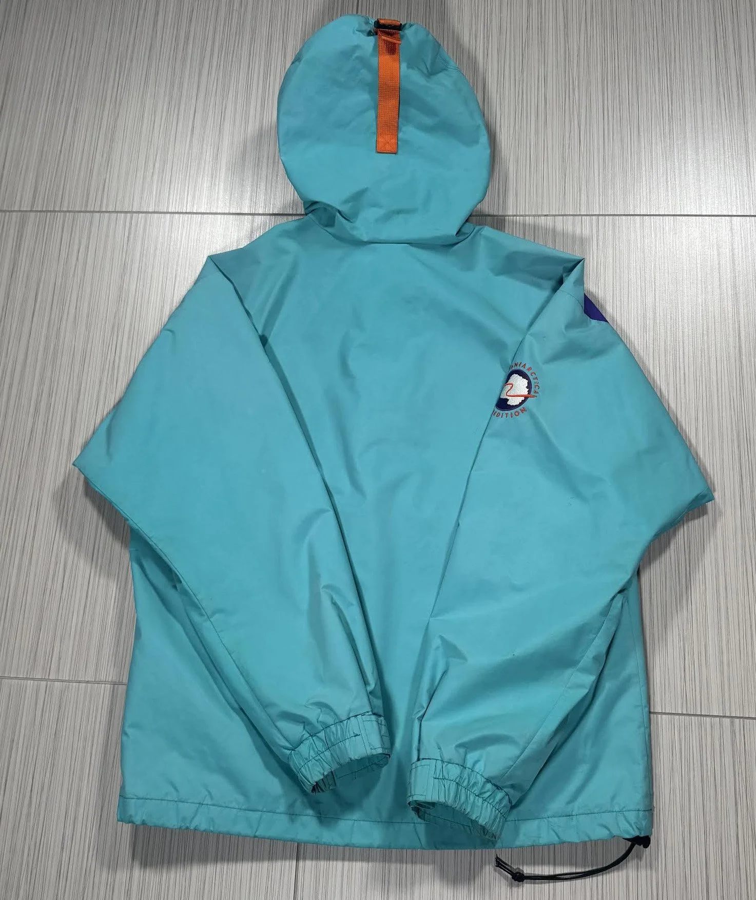 back of TAE Teal Jacket.jpg