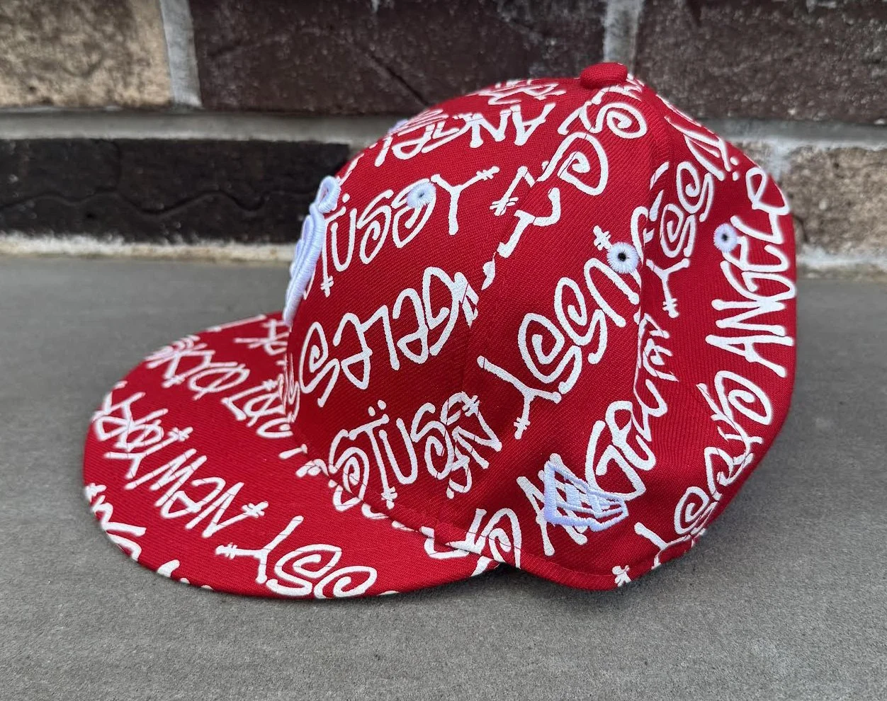 side of New Era Stussy Hat.jpg