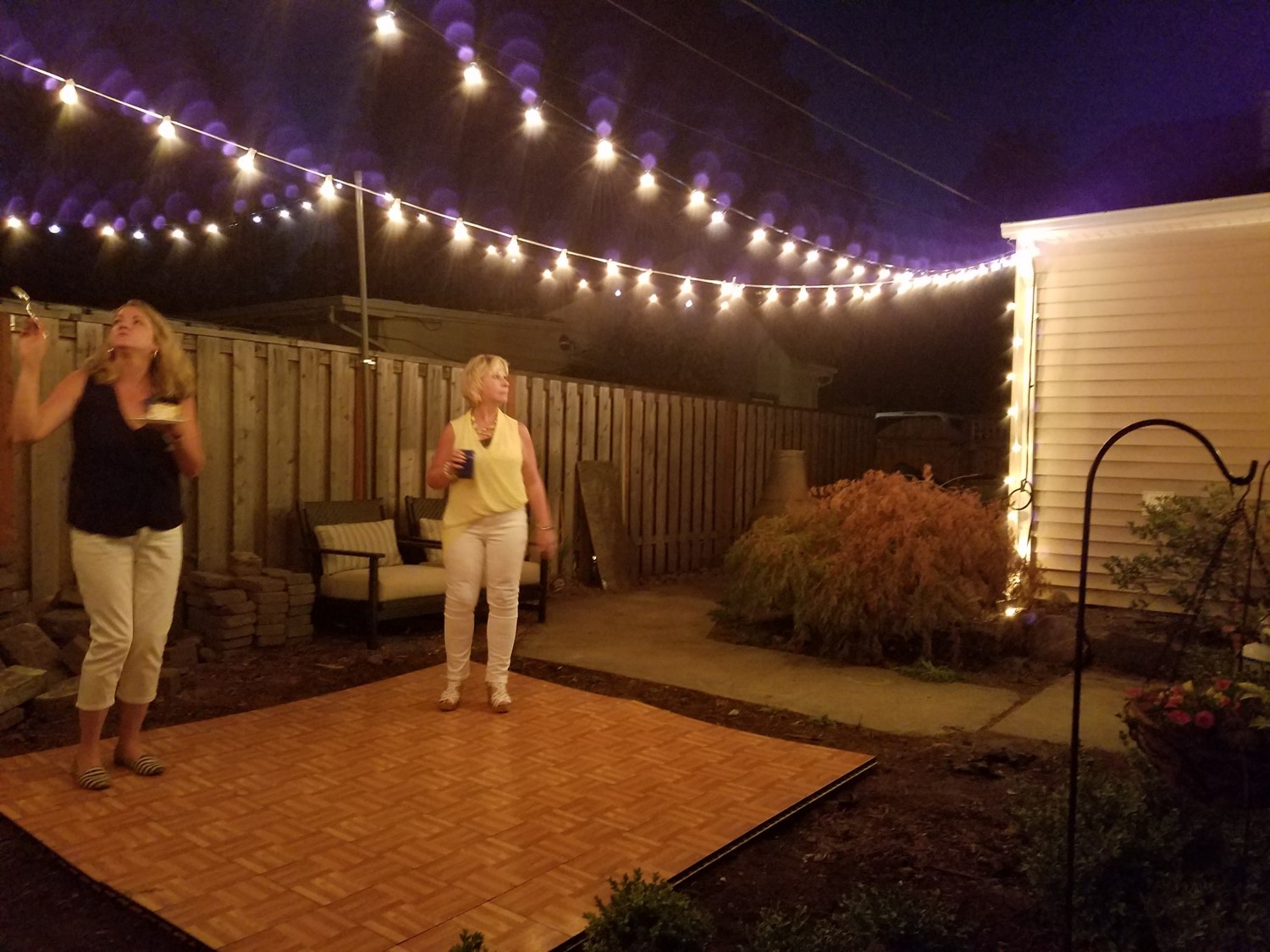 I made an attempt to rent a dance floor for the ladies but my yard is not yet level so it didn't look or feel the way it should but it definitley got me excited about the idea of a permanent dance floor in my backyard. PROJECT!