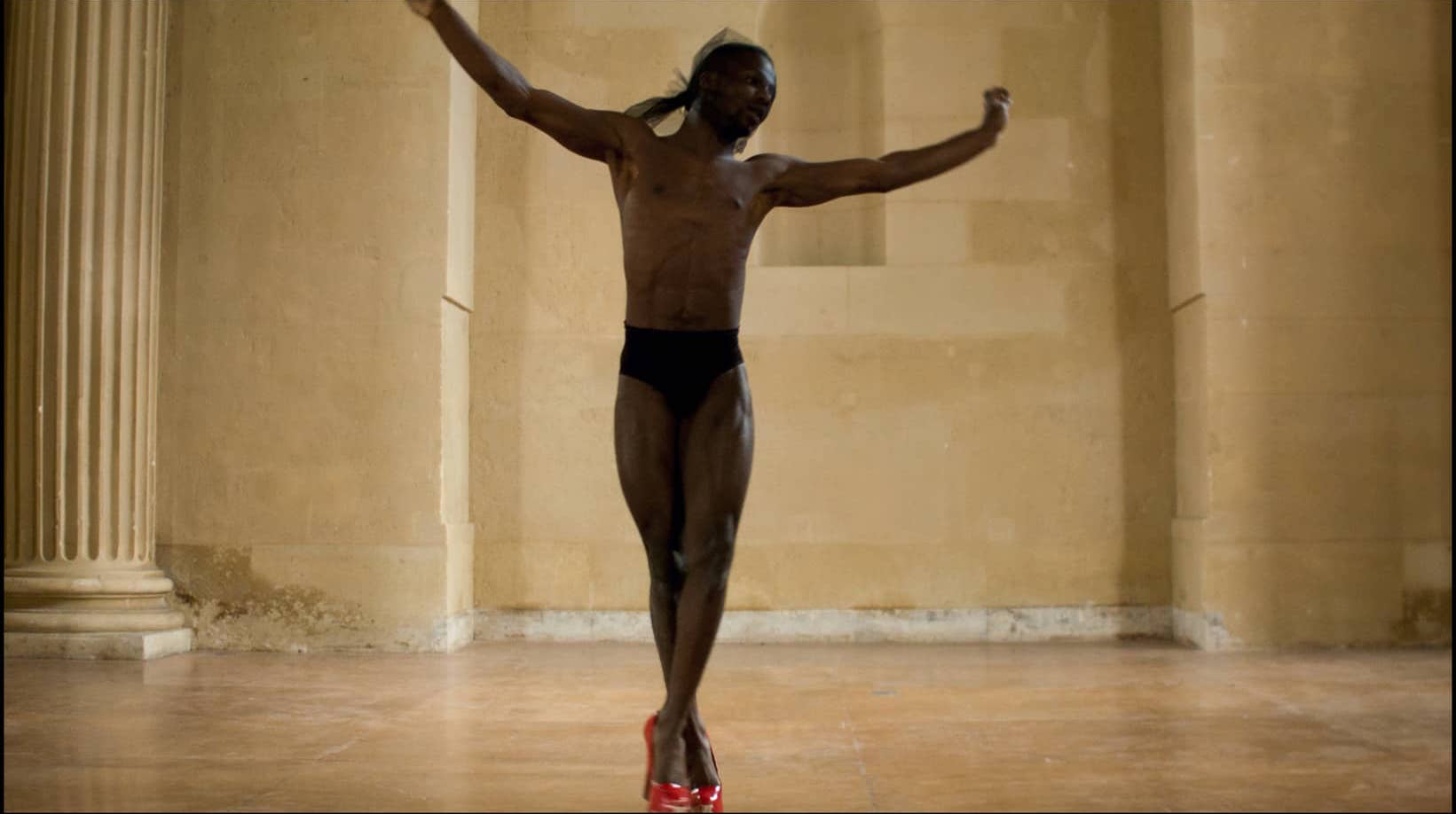 RED SHOES, Frédéric Nauczyciel, 2015, 4:17min Still: House of HMU LINK: https://vimeo.com/132228516 Nauczyciel was a production manager for a dance theater when he fell in love with the camera. Today he works primarily in photography, video and performance in Paris and the US. Red Shoes explores the concept of masculinity in the underground voguing world of Baltimore–in red patent leather stilettos of course. 