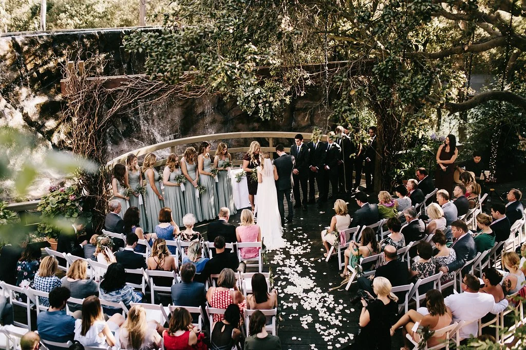 How incredible is this ceremony site? Huge trees and a waterfall as the backdrop.