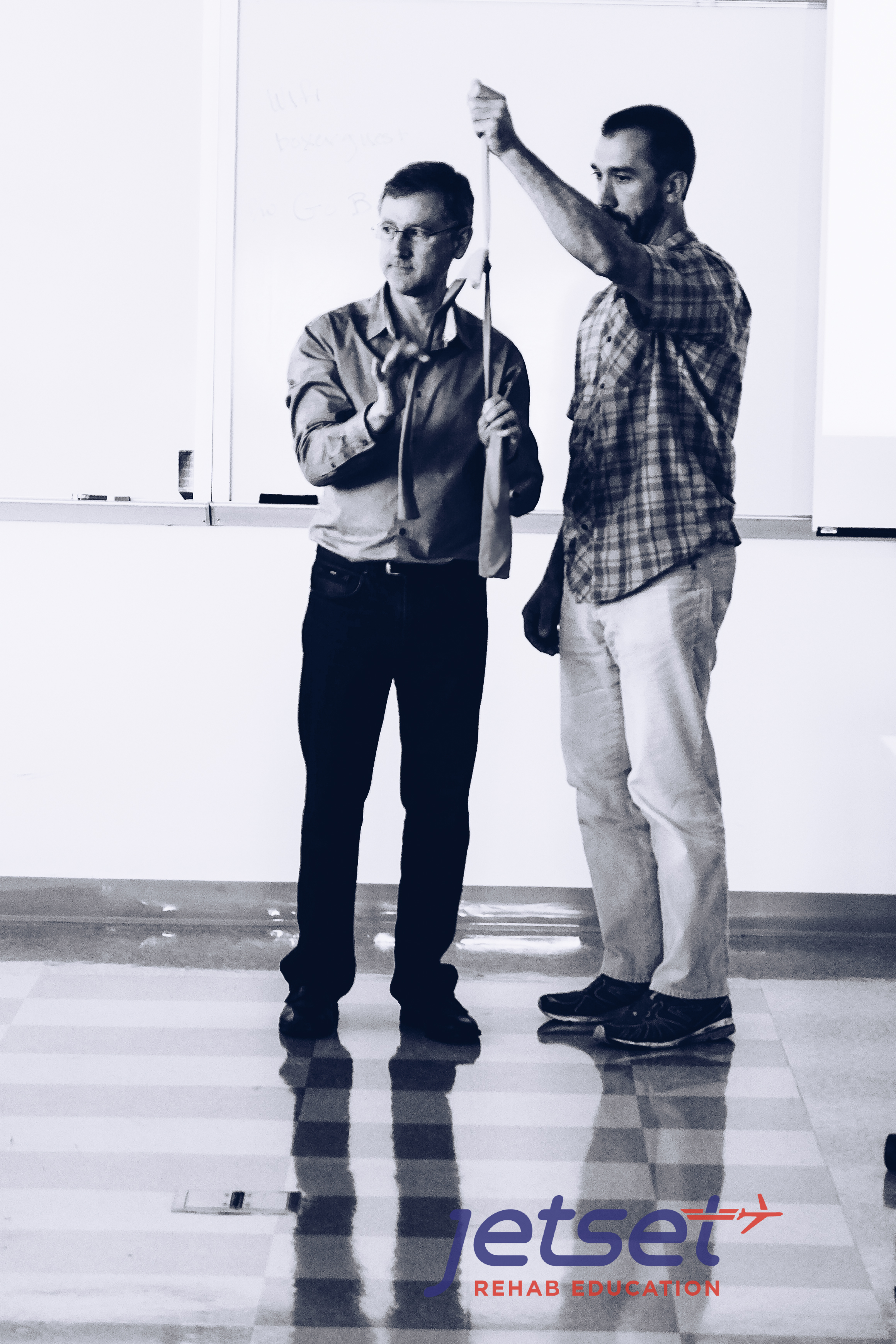 We start the morning learning how tension on a contralateral nerve can take the tension off of a painful nerve. See the video below where Michael Shacklock (left) explains this concept.