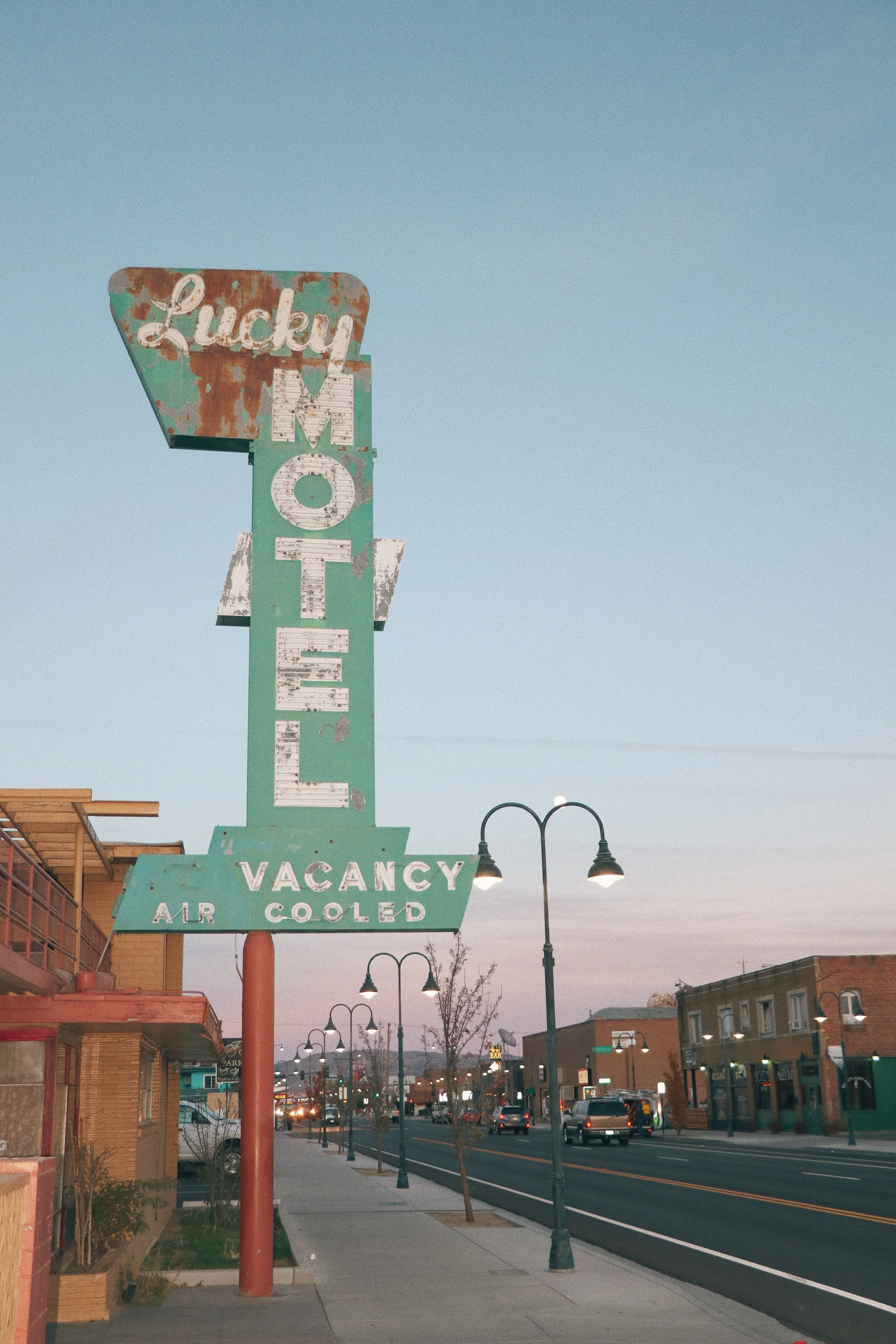lucky motel sign in reno nevada against sunset on 4th street