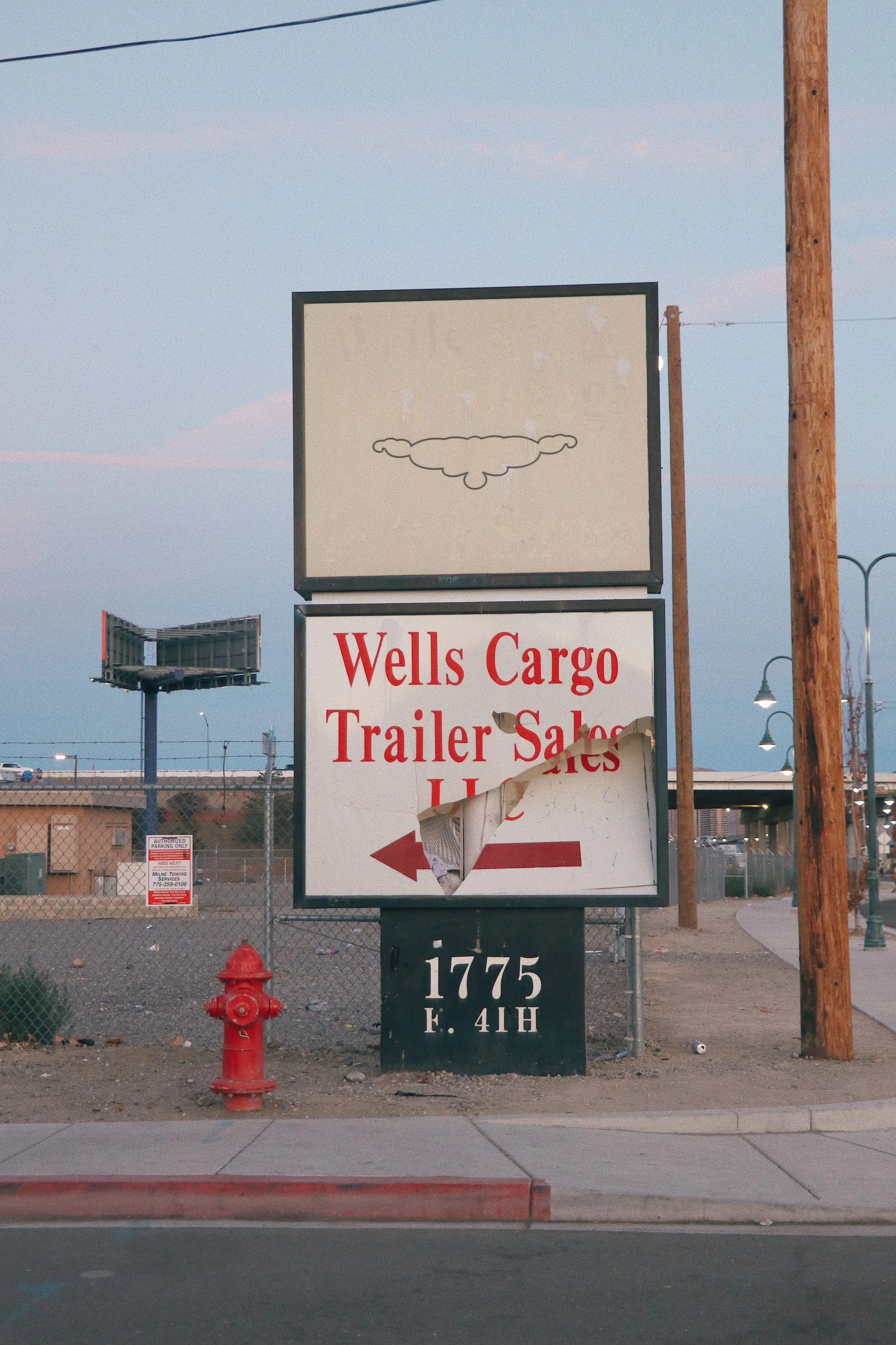 a photo of signs in reno nevada against sky backdrop