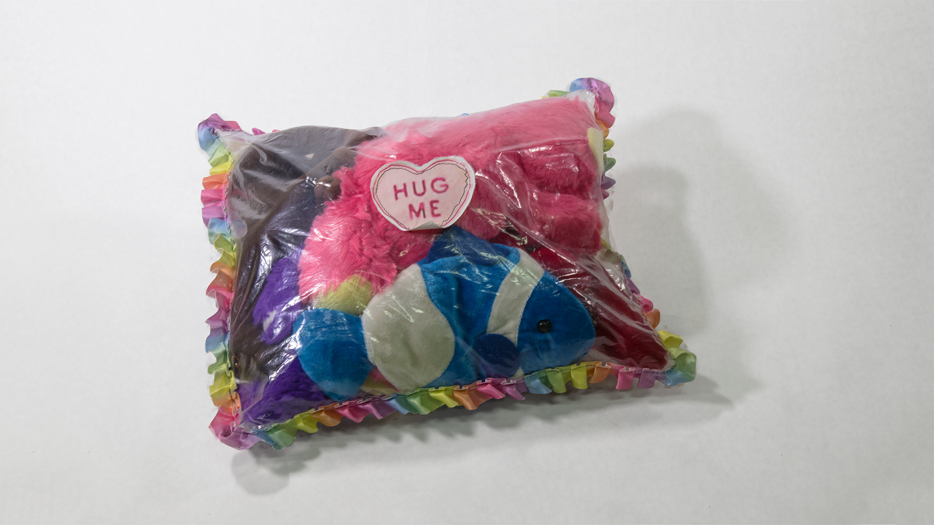 Hug Me stuffed animals, plastic, ribbon 14” x 12” x 6” 2017