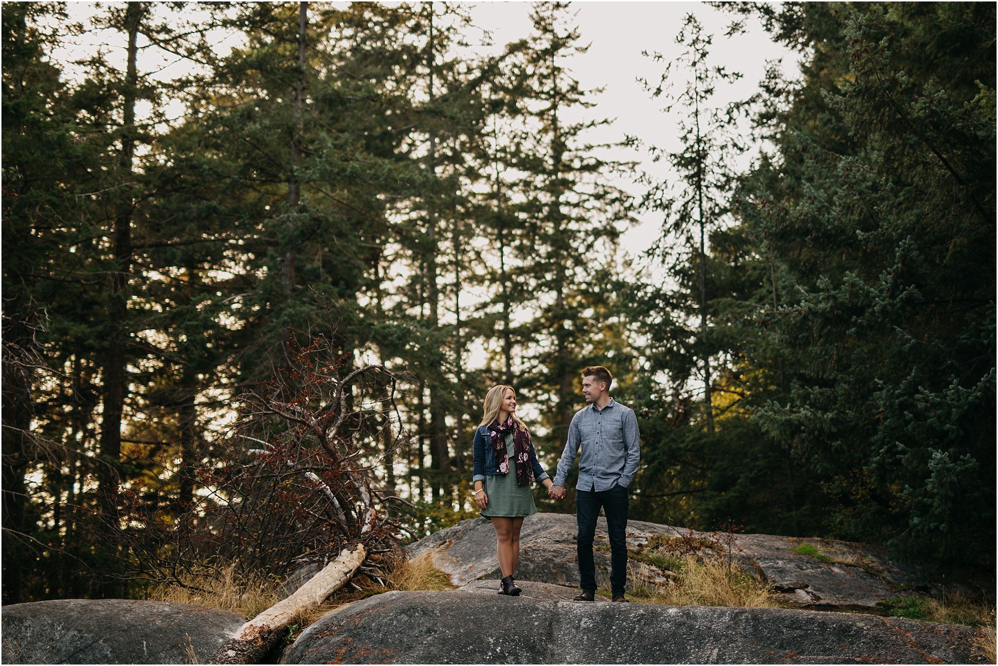 guy and girl holding hands in forest