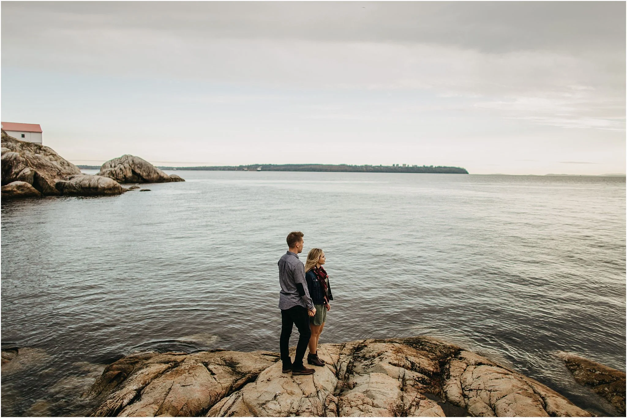 couple looking out at ocean at lighthouse park