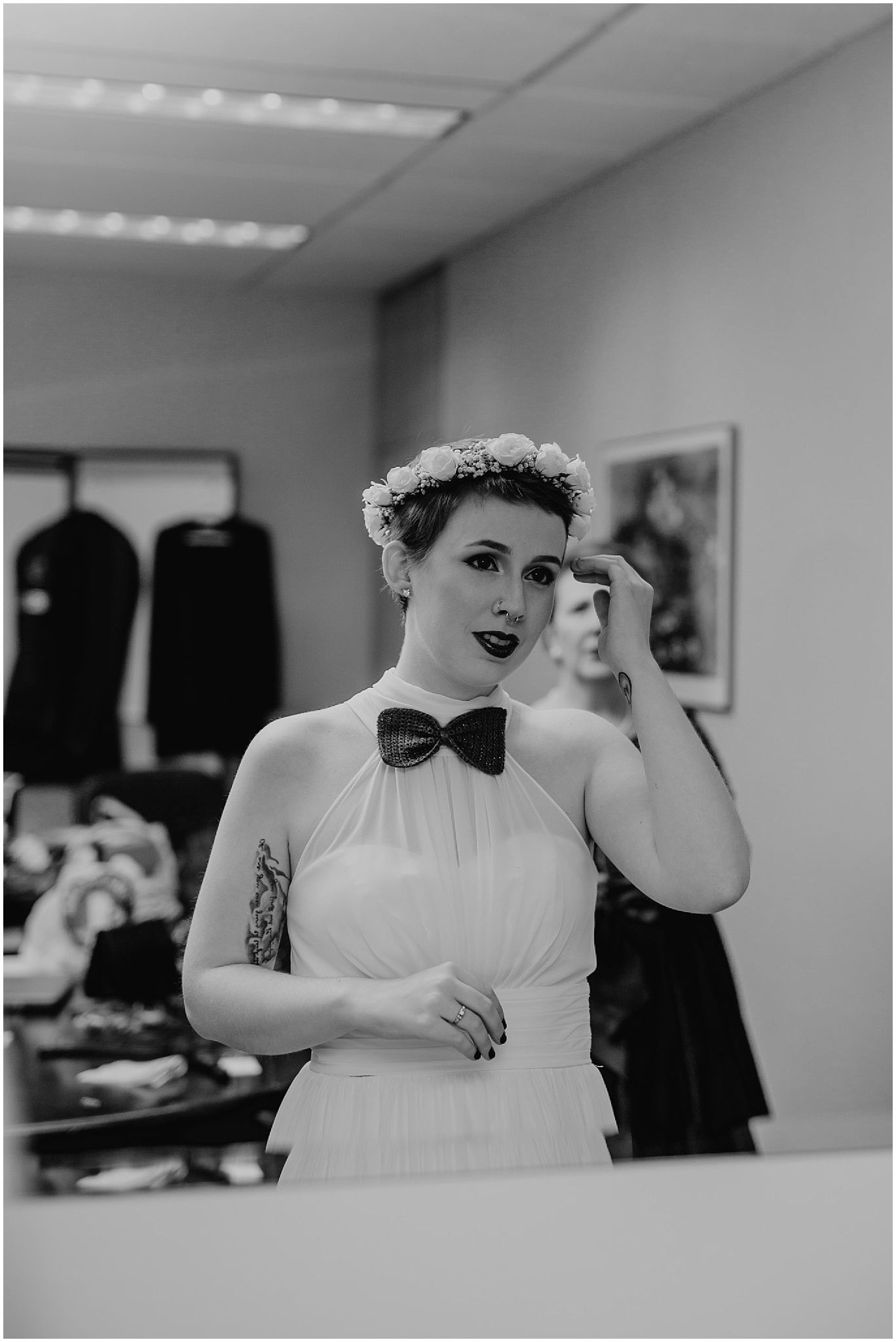 bride looking in mirror wedding dress flower crown