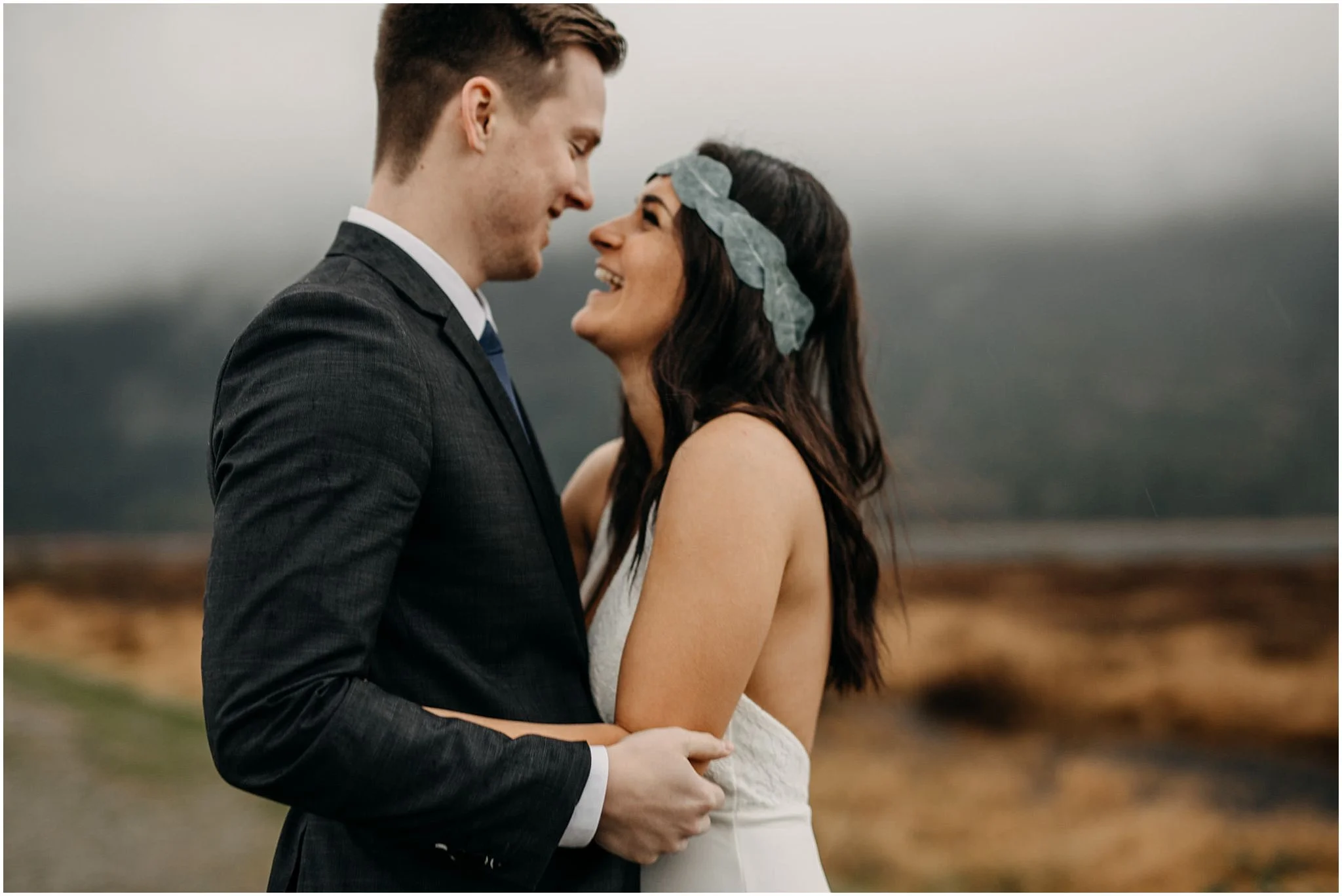 bride groom arms wrapped around each other pitt lake foggy