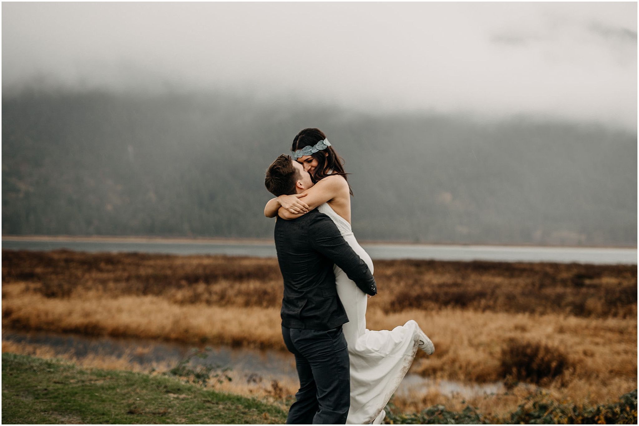 groom lifting bride pitt lake foggy portraits