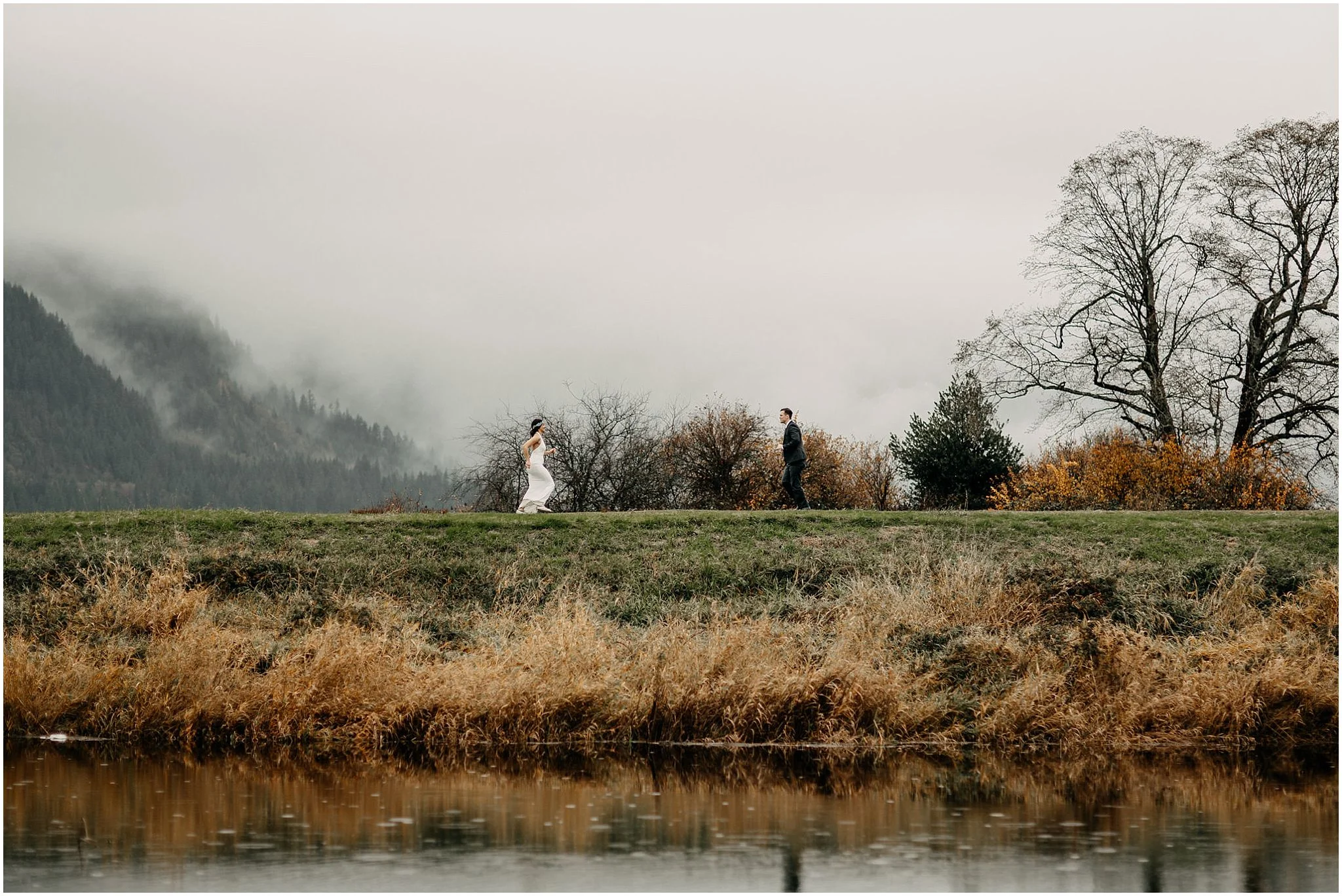 couple running towards each other pitt lake marsh engagement