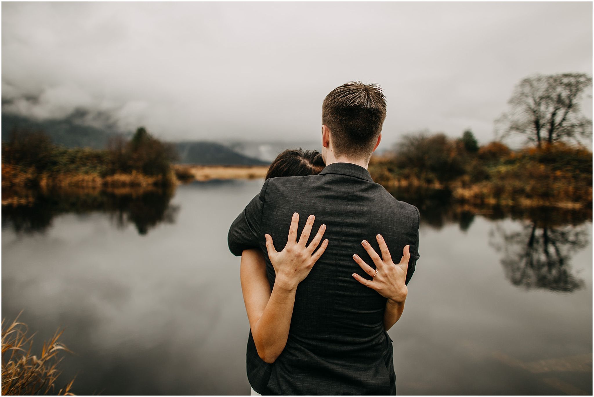 couple hugging pitt lake engagement 