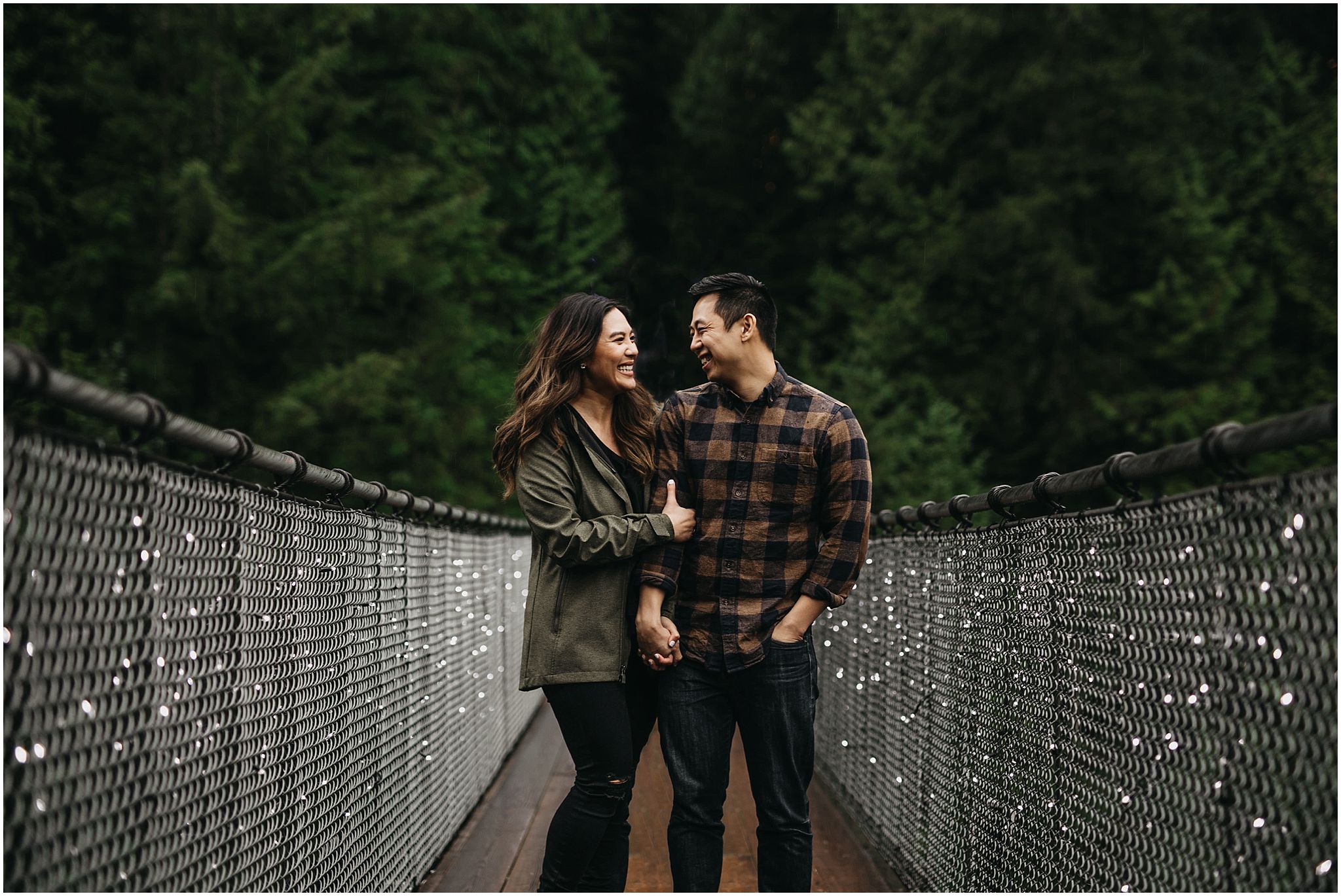 engaged couple on capilano suspension bridge canyon lights engagement photos