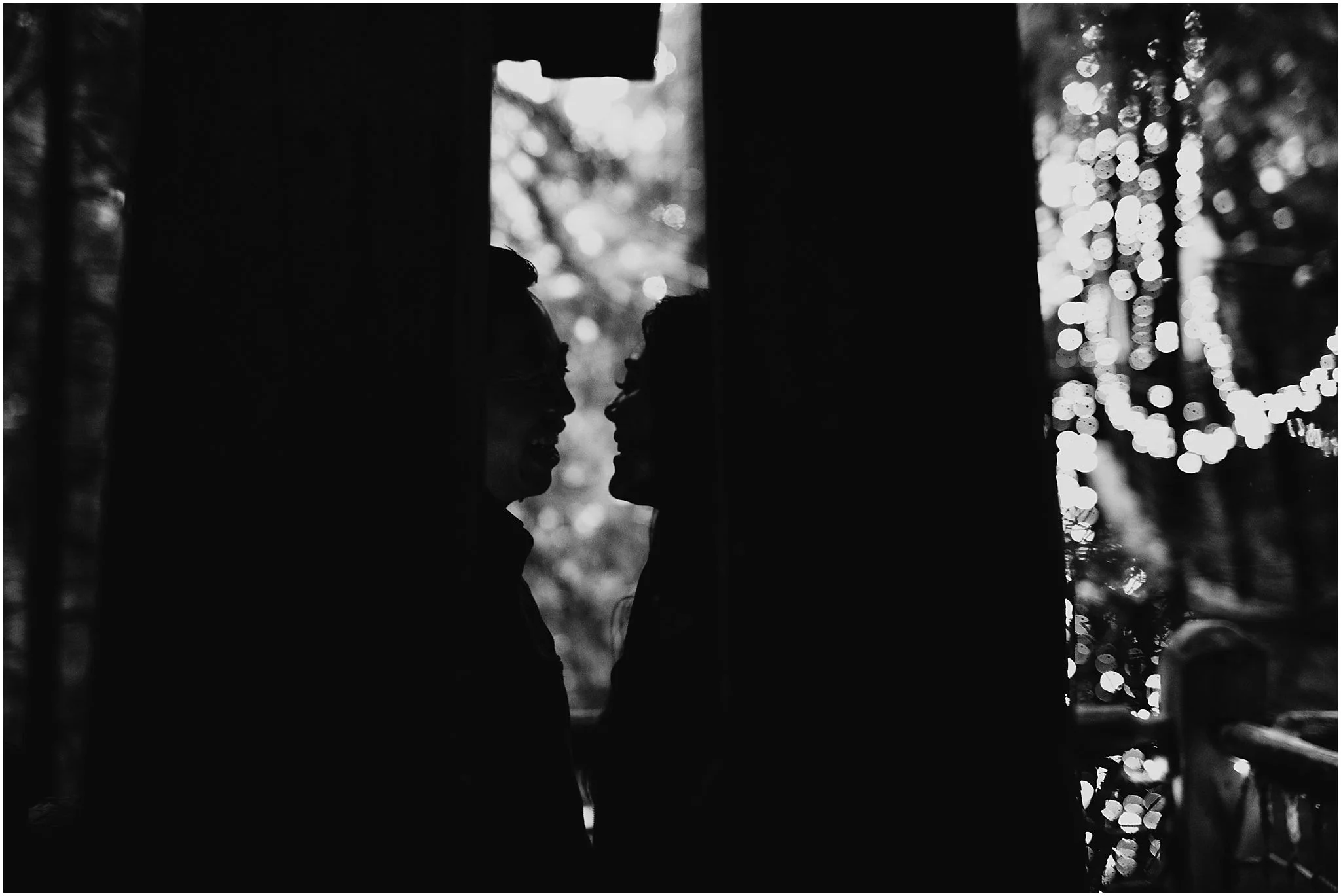 couple silhouette capilano suspension bridge treetop canyon lights
