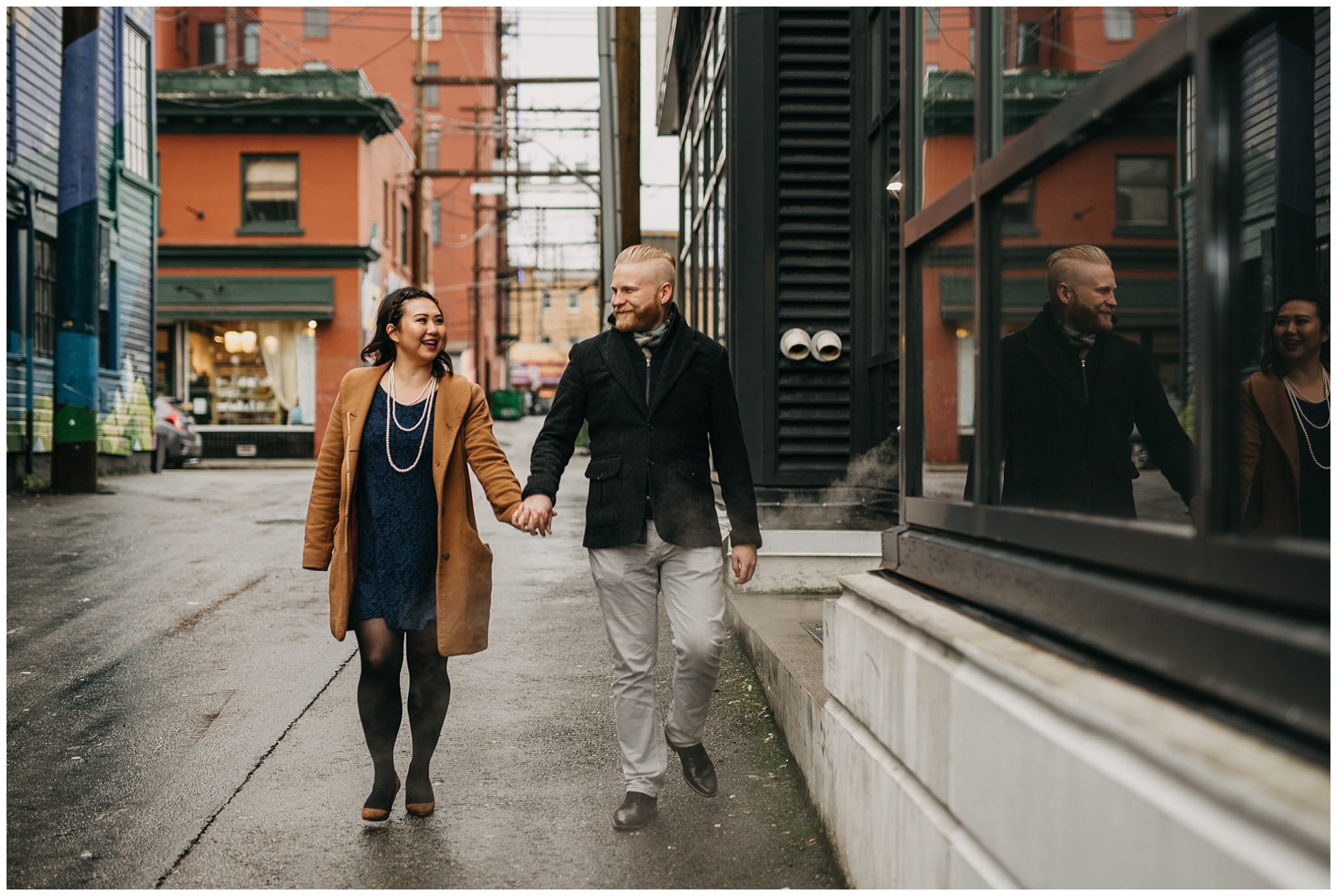 engaged couple holding hands walking vancouver alley city