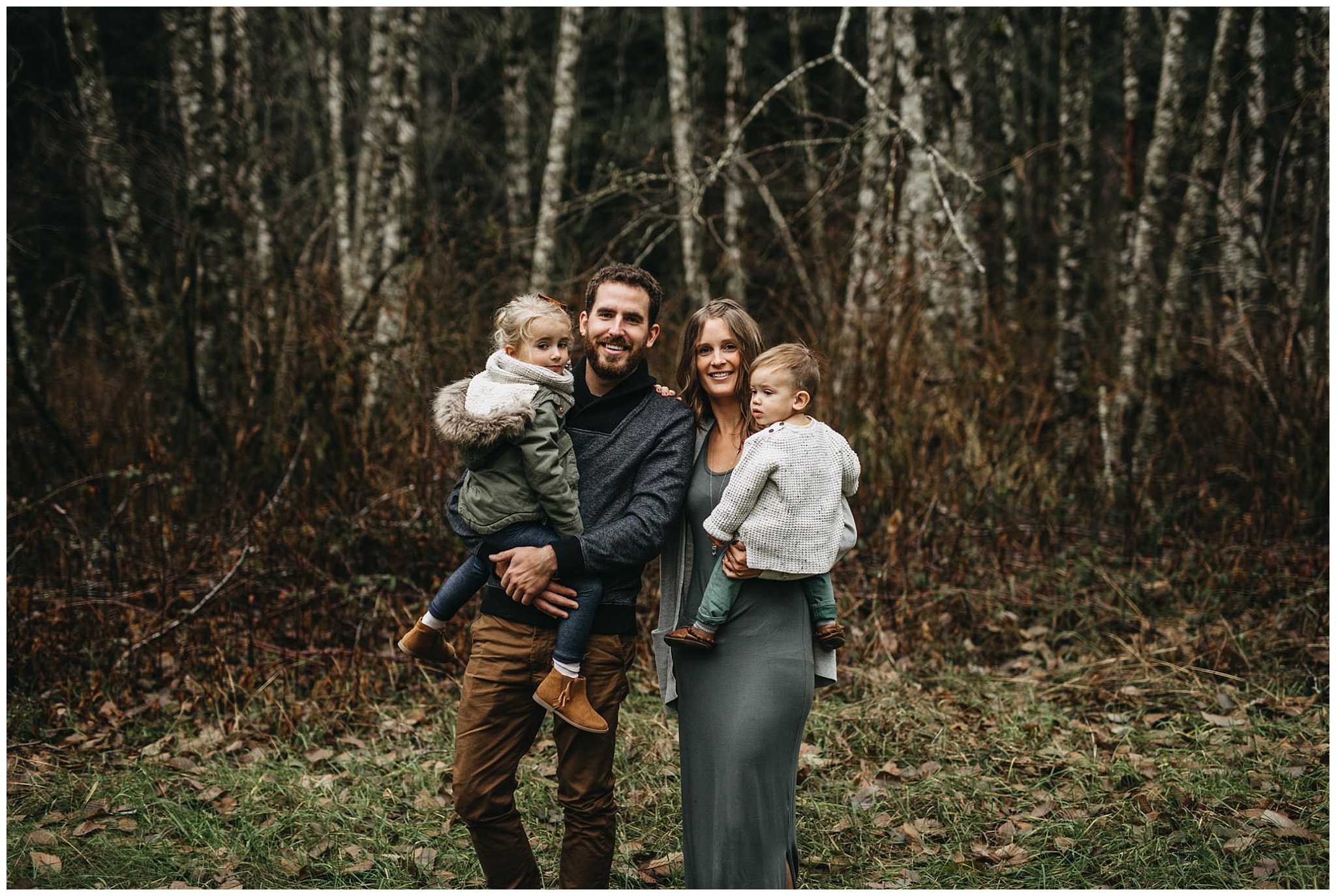 family photos chilliwack forest trees parents holding kids