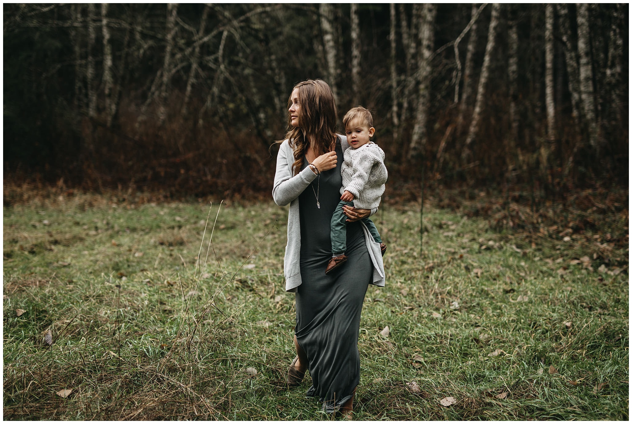 mom holding son walking through forest chilliwack family photos