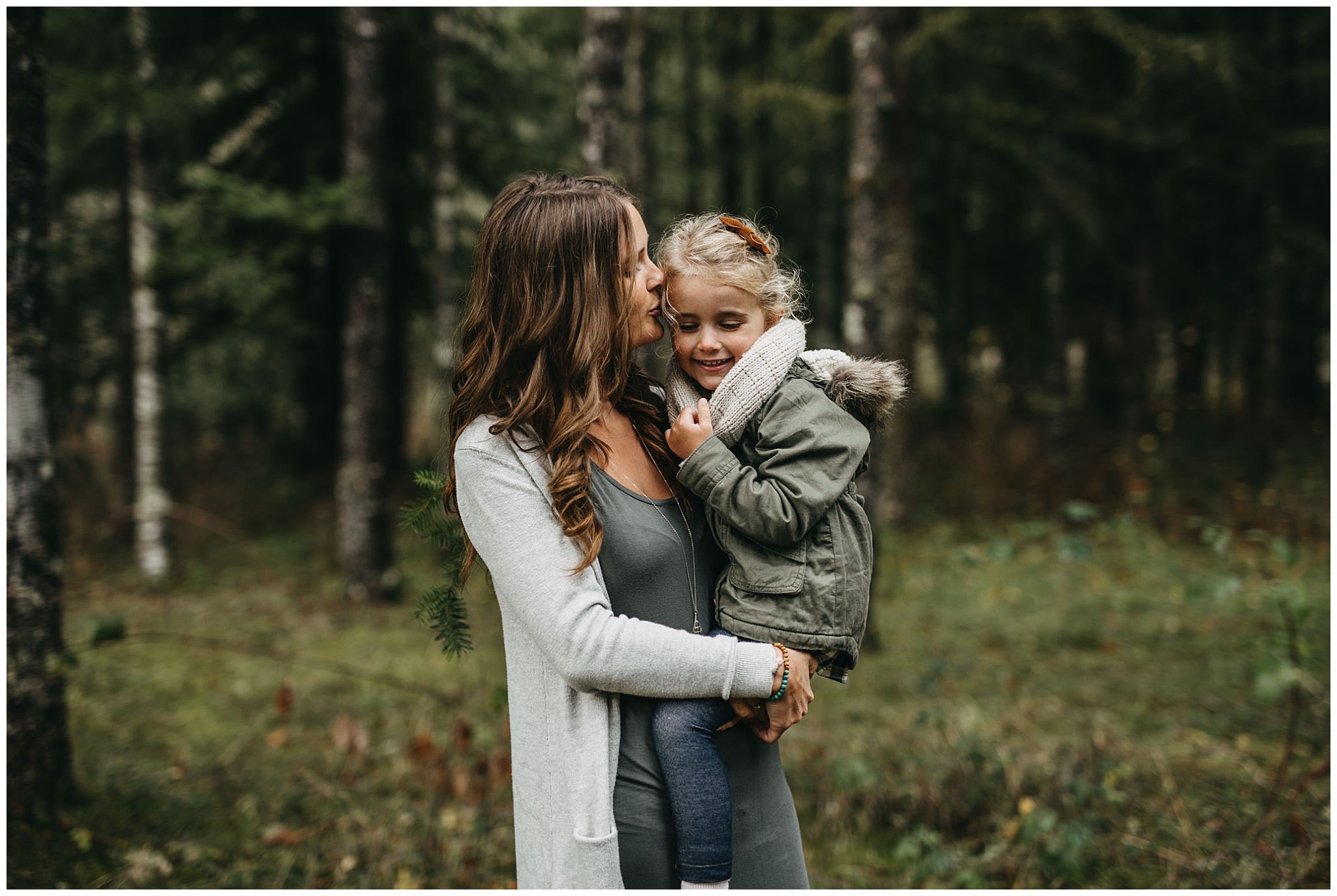 mom kissing daughter on cheek family photos chilliwack forest