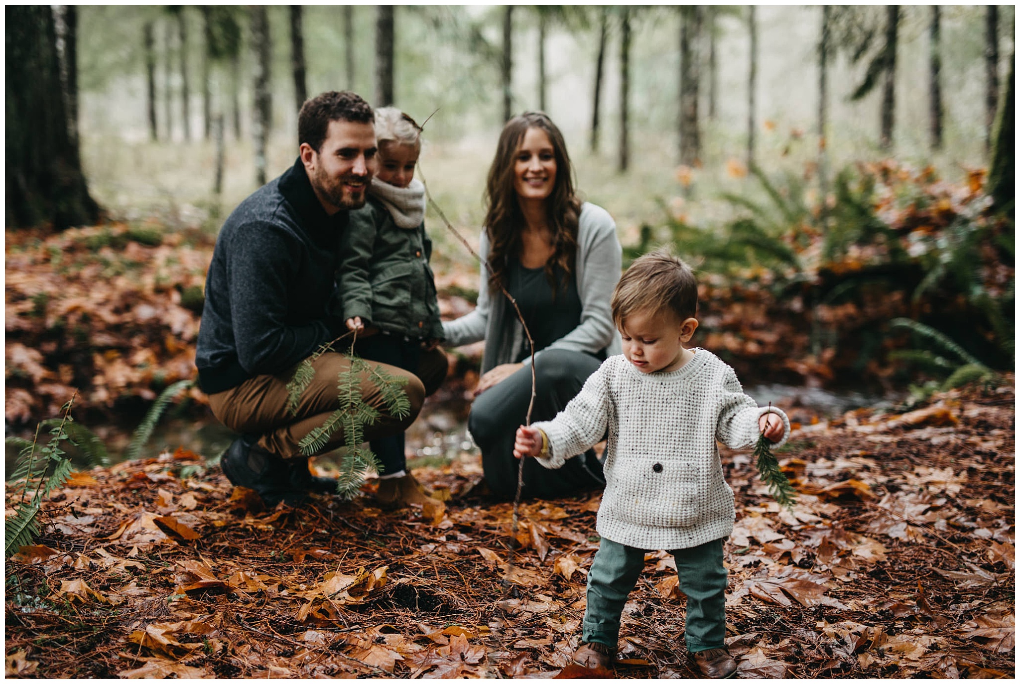 son playing with sticks and leaves family photos chilliwack forest trees