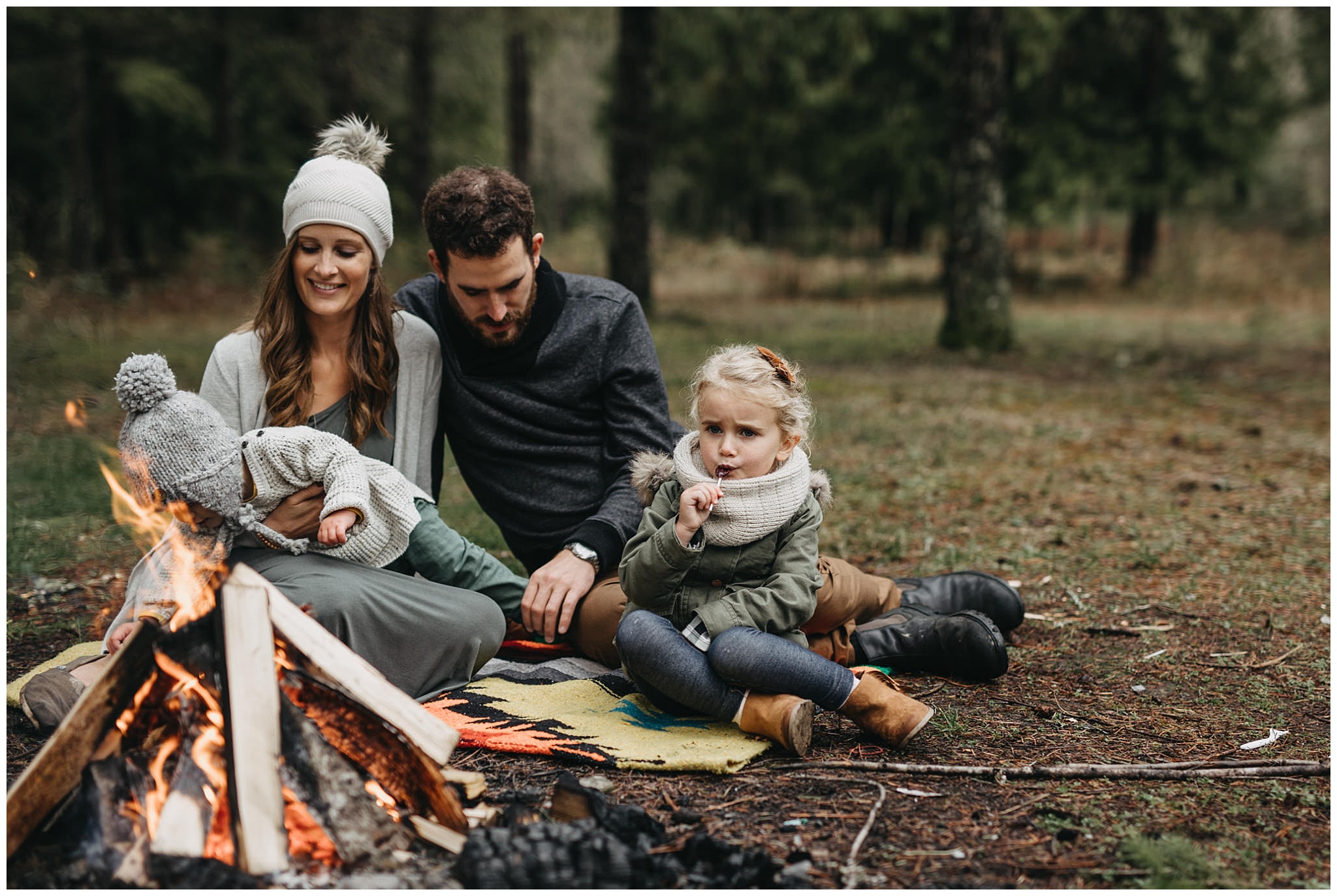 family hanging around campfire candid chilliwack family photos