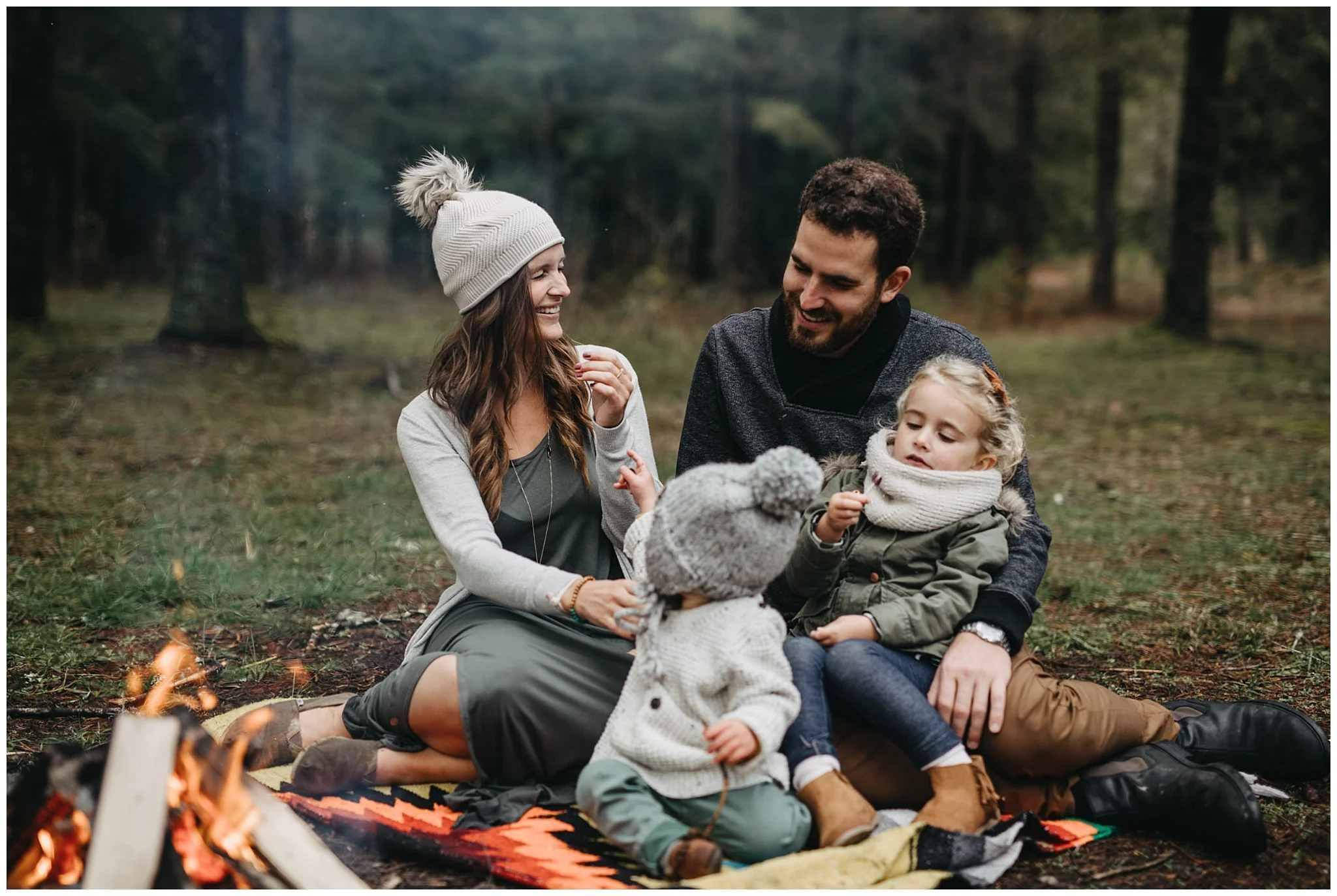 mom dad laughing kids playing campfire blanket chilliwack forest