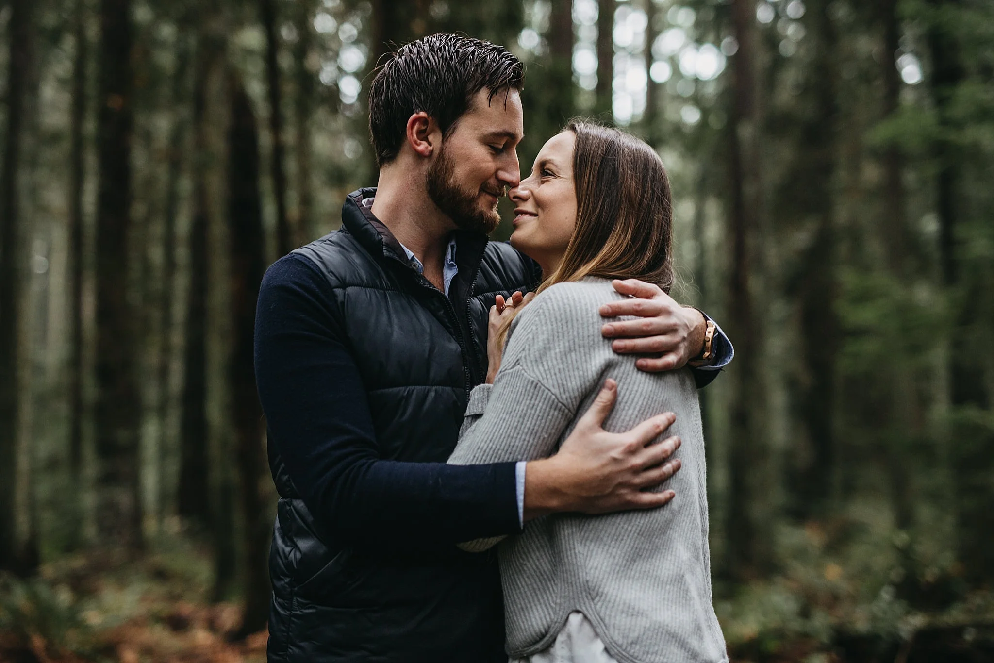 couple hug engagement session pacific spirit park forest