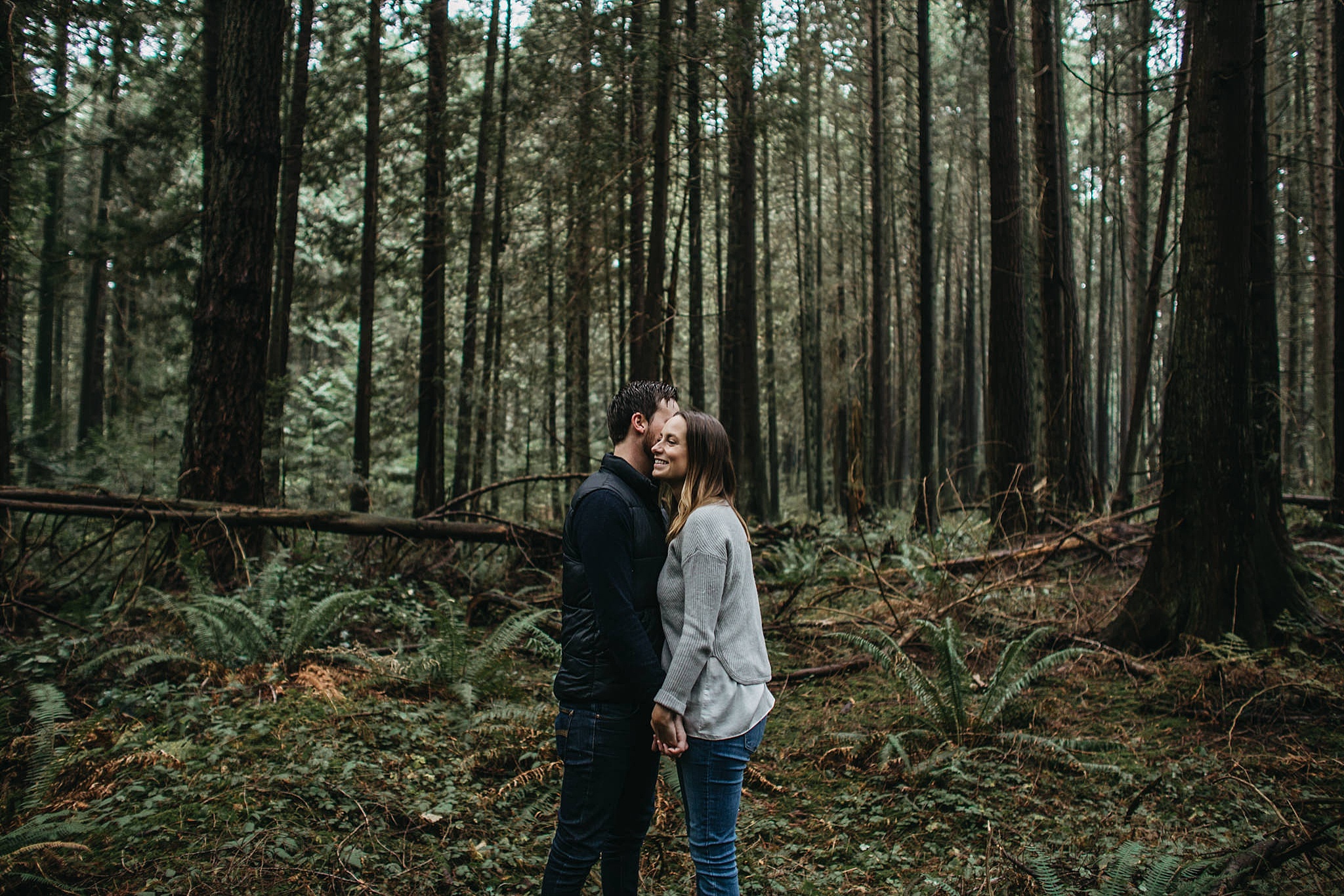 couple cute engagement photos in forest pacific spirit park