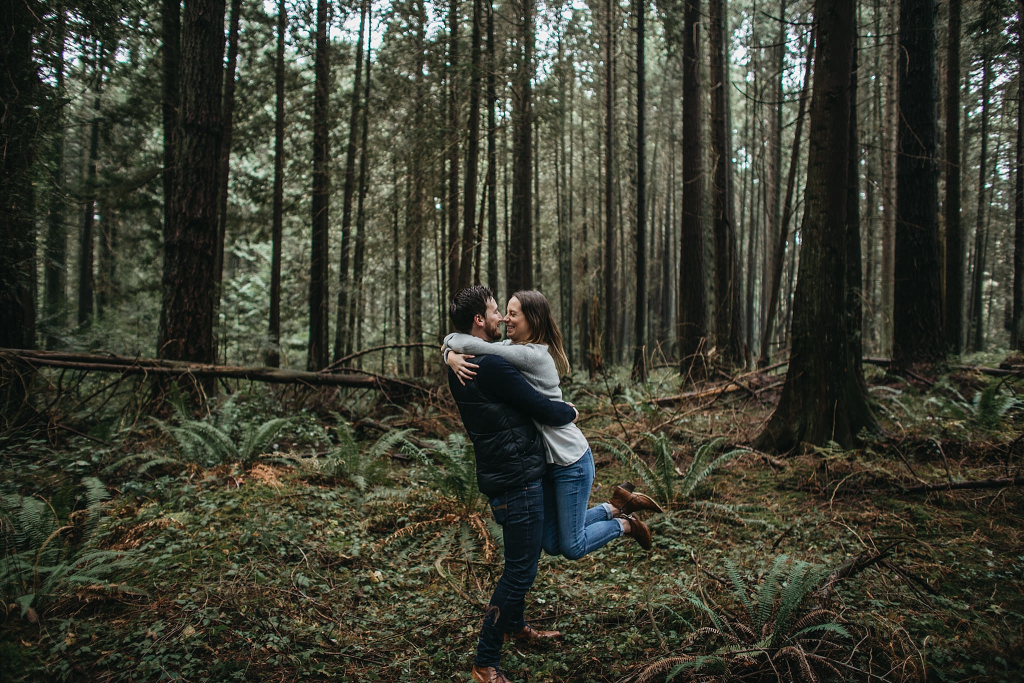 fiance engaged engagement photos pacific spirit park couple spinning