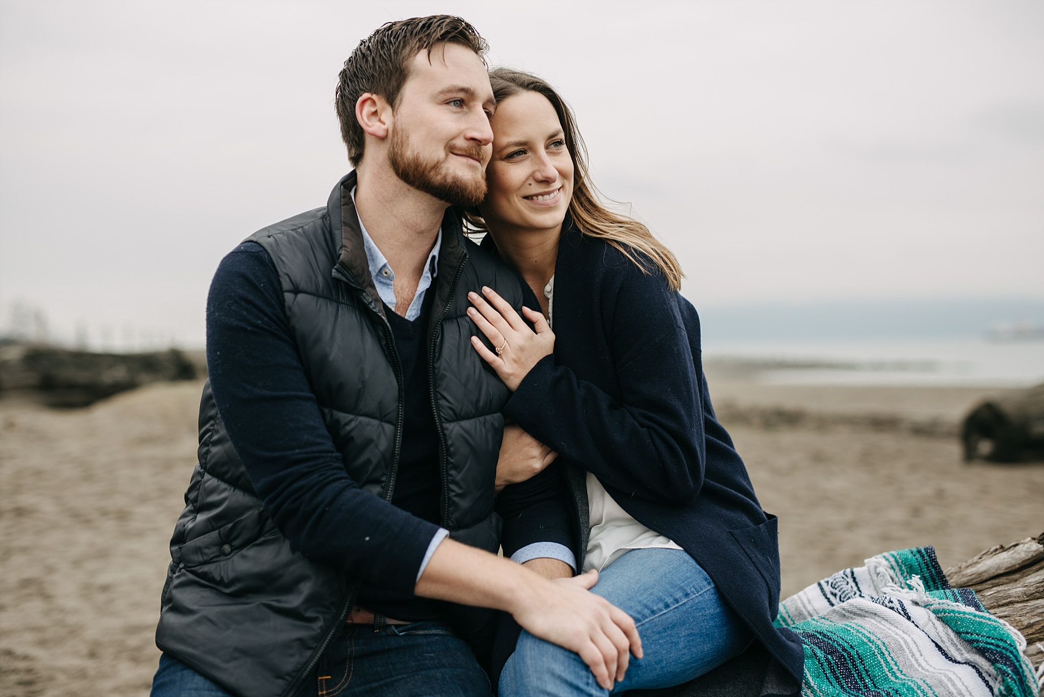 spanish banks beach engagement photos couple smiling