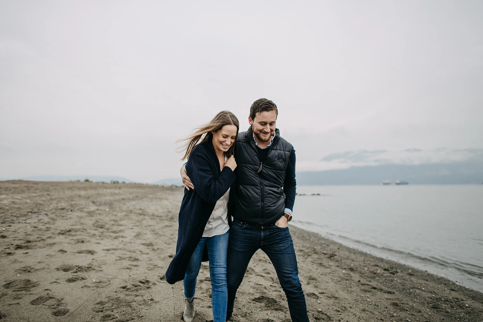 couple walking goofy laughing candid spanish banks engagement