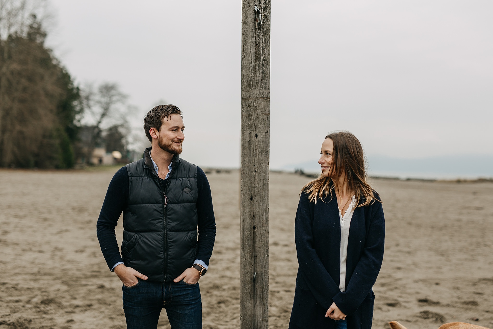 couple looking at each other engagement photos spanish banks