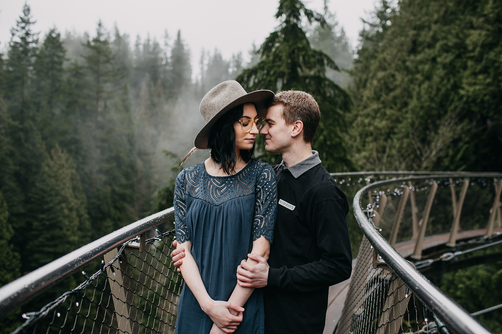 foggy forest capilano suspension bridge engagement photos couple
