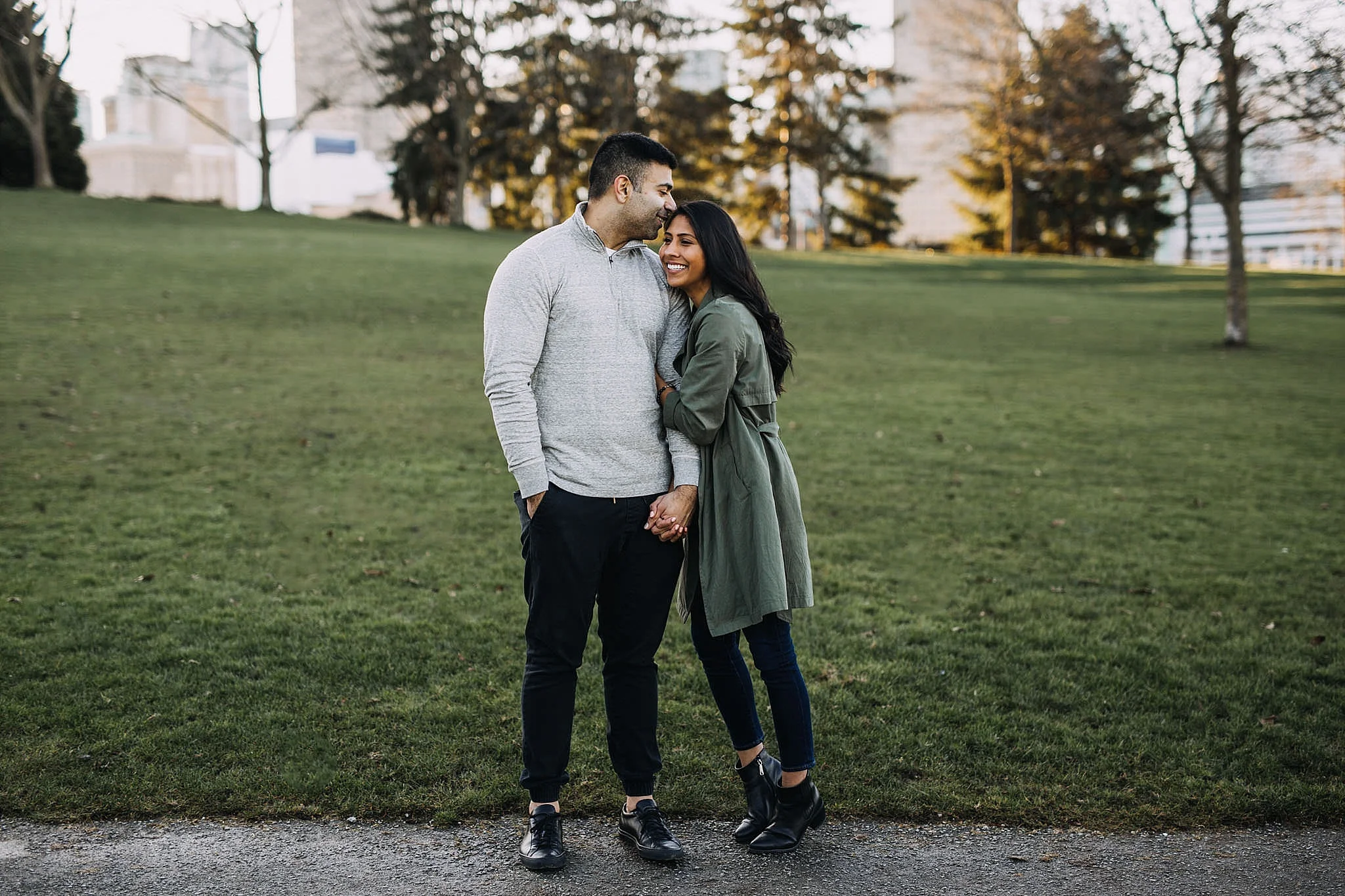 couple hugging crab park engagement vancouver sunset