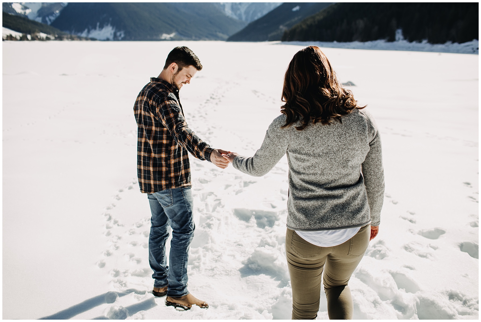 couple walking on snow jones lake chilliwack engagement