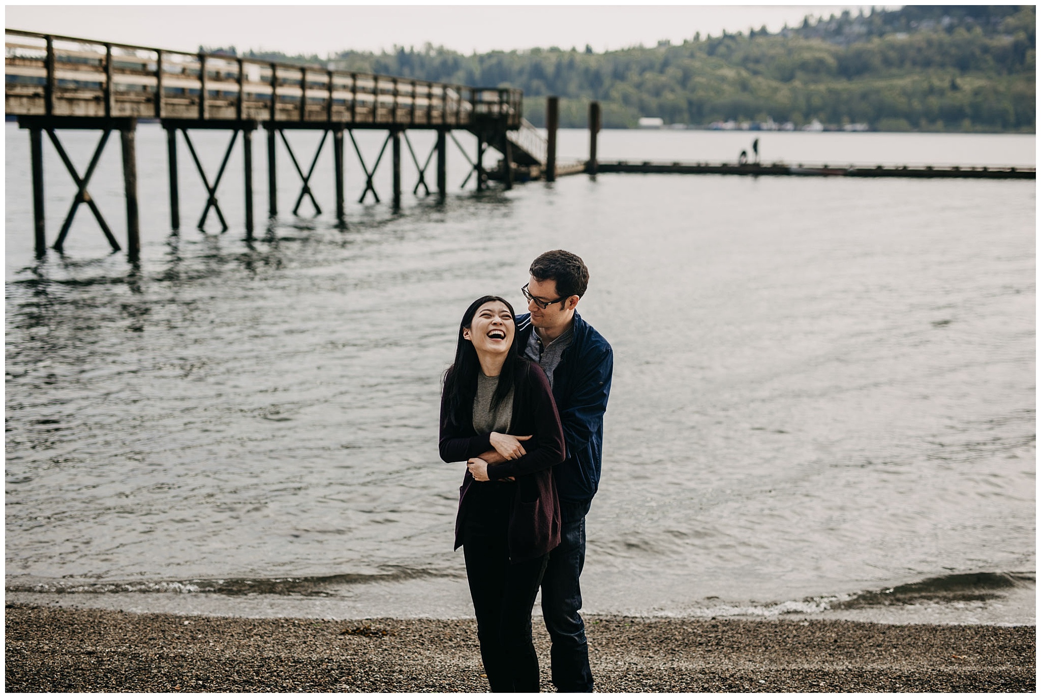 north vancouver cates park beach boardwalk couple laugh candid engagement