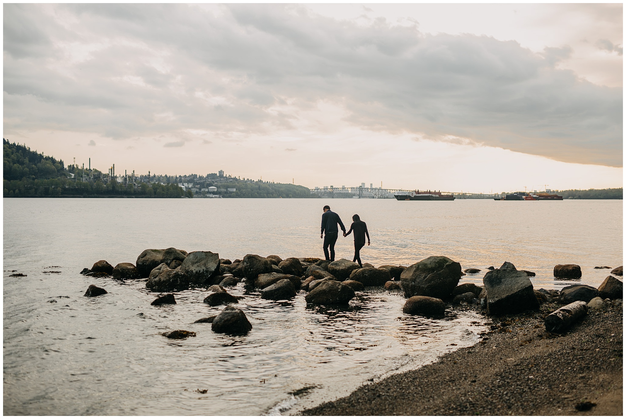 couple silhouette beach sunset rocks north vancouver engagement
