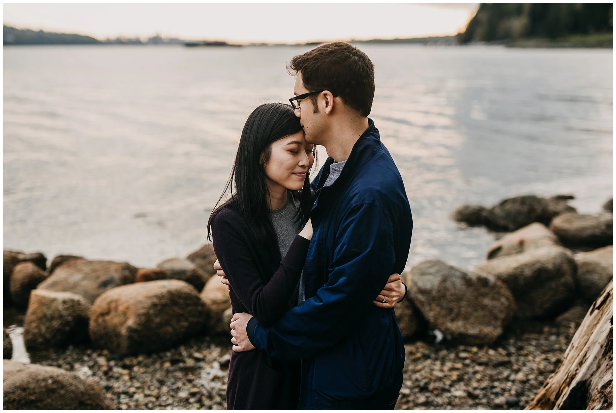 couple kiss forehead beach sunset north vancouver cates park engagement