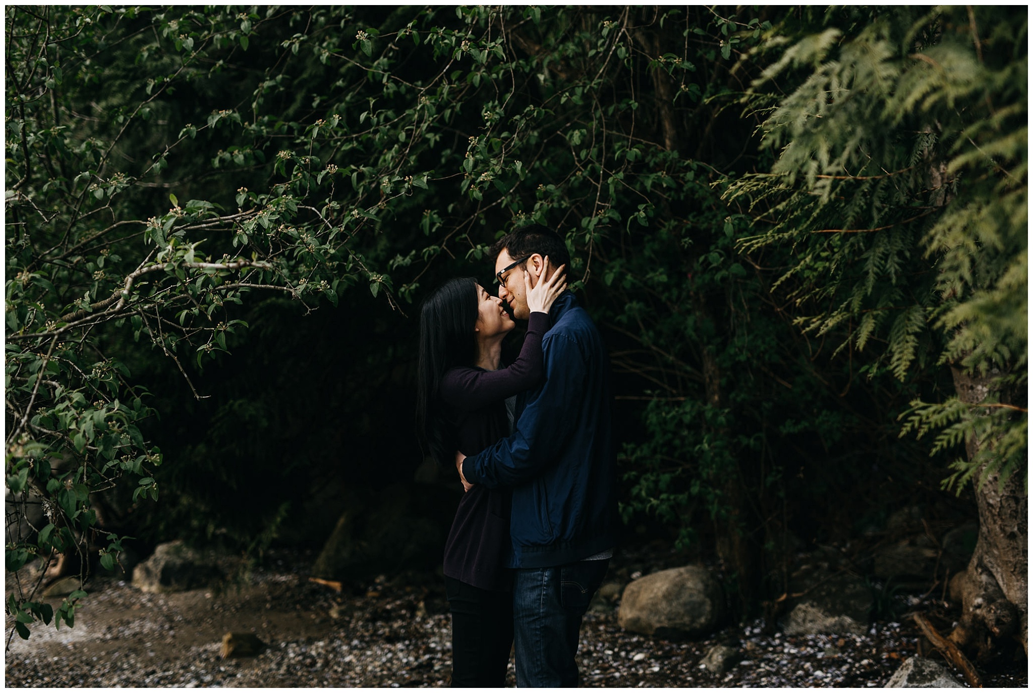 couple in forest engagement session north vancouver beach sunset