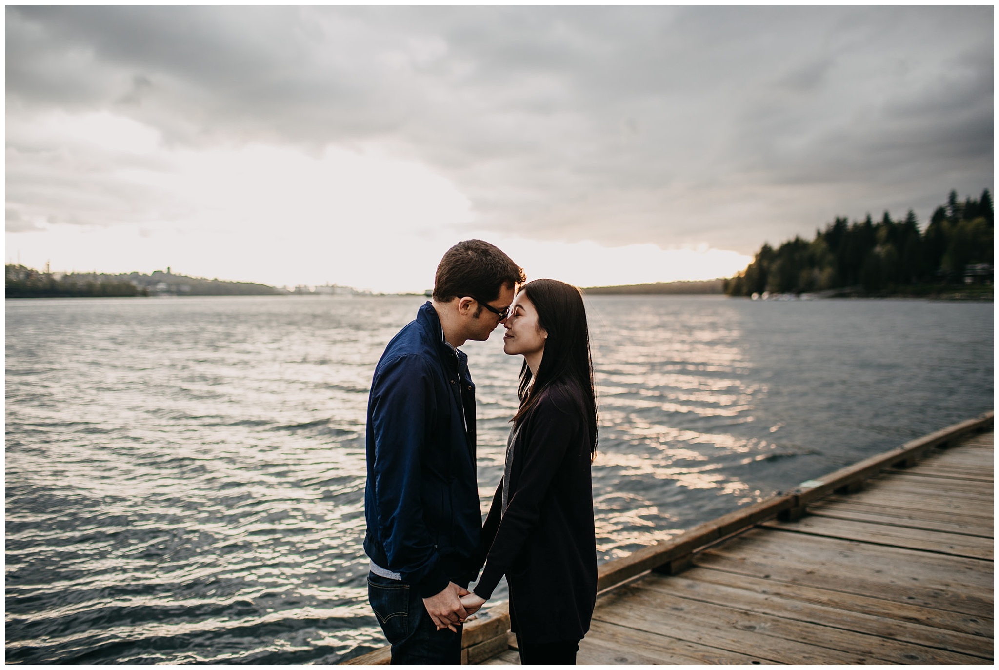 golden vancouver sunset engagement session couple on dock