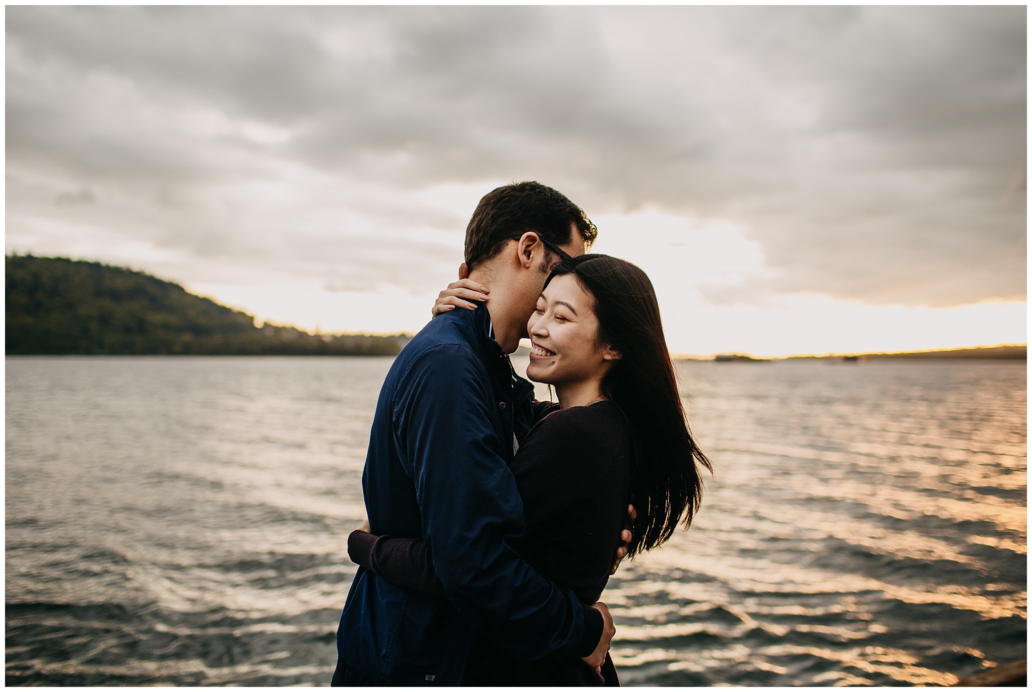 couple on dock north vancouver engagement golden sunset windy