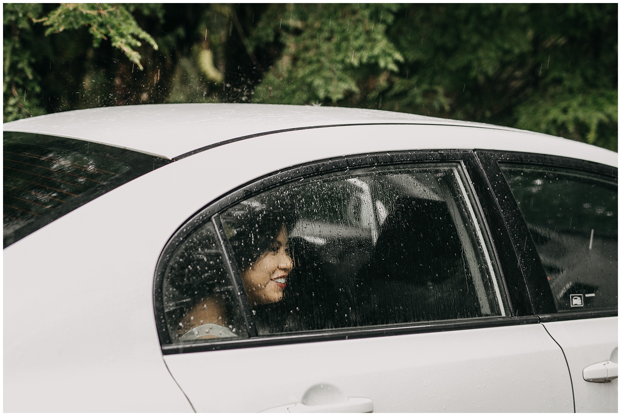 bride in car rain on glass window pnw golden ears intimate wedding