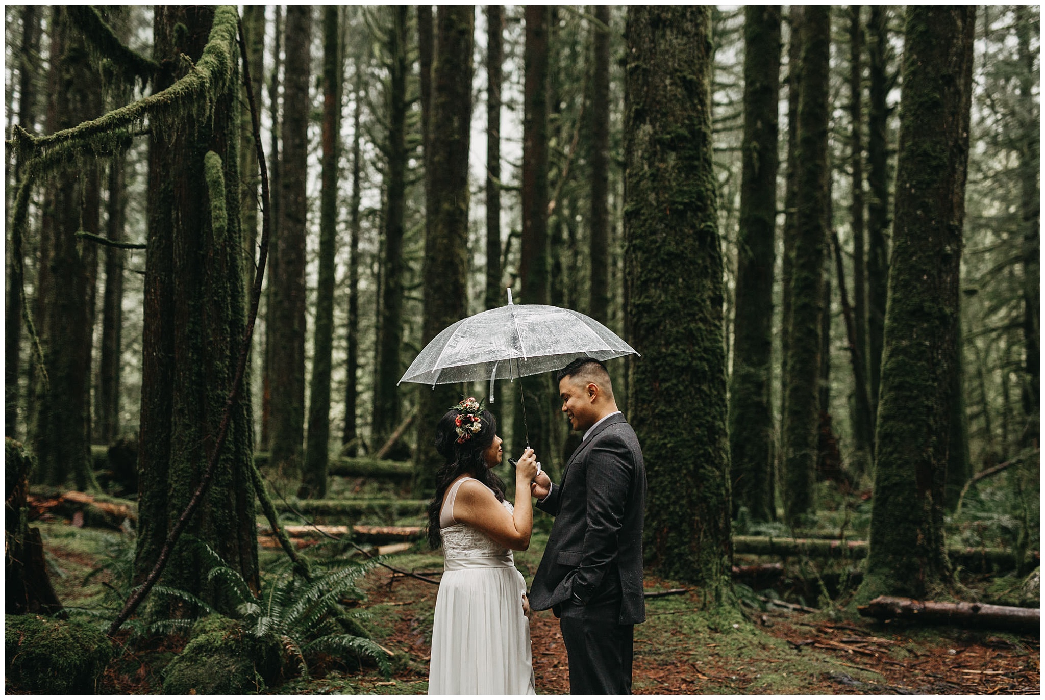 groom reading vows to bride in mossy forest rainy intimate wedding golden ears park