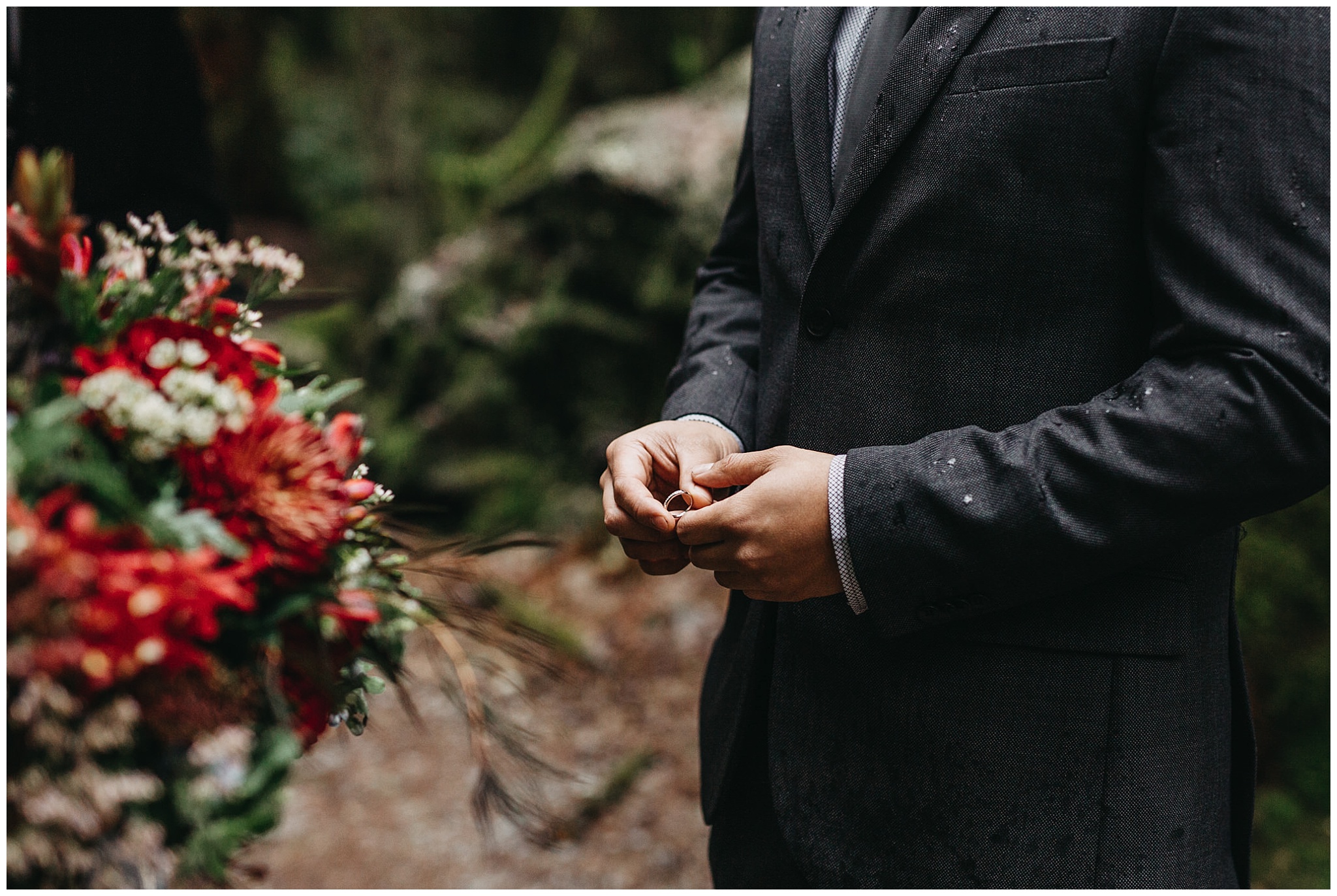 groom holding wedding band intimate forest ceremony golden ears wedding