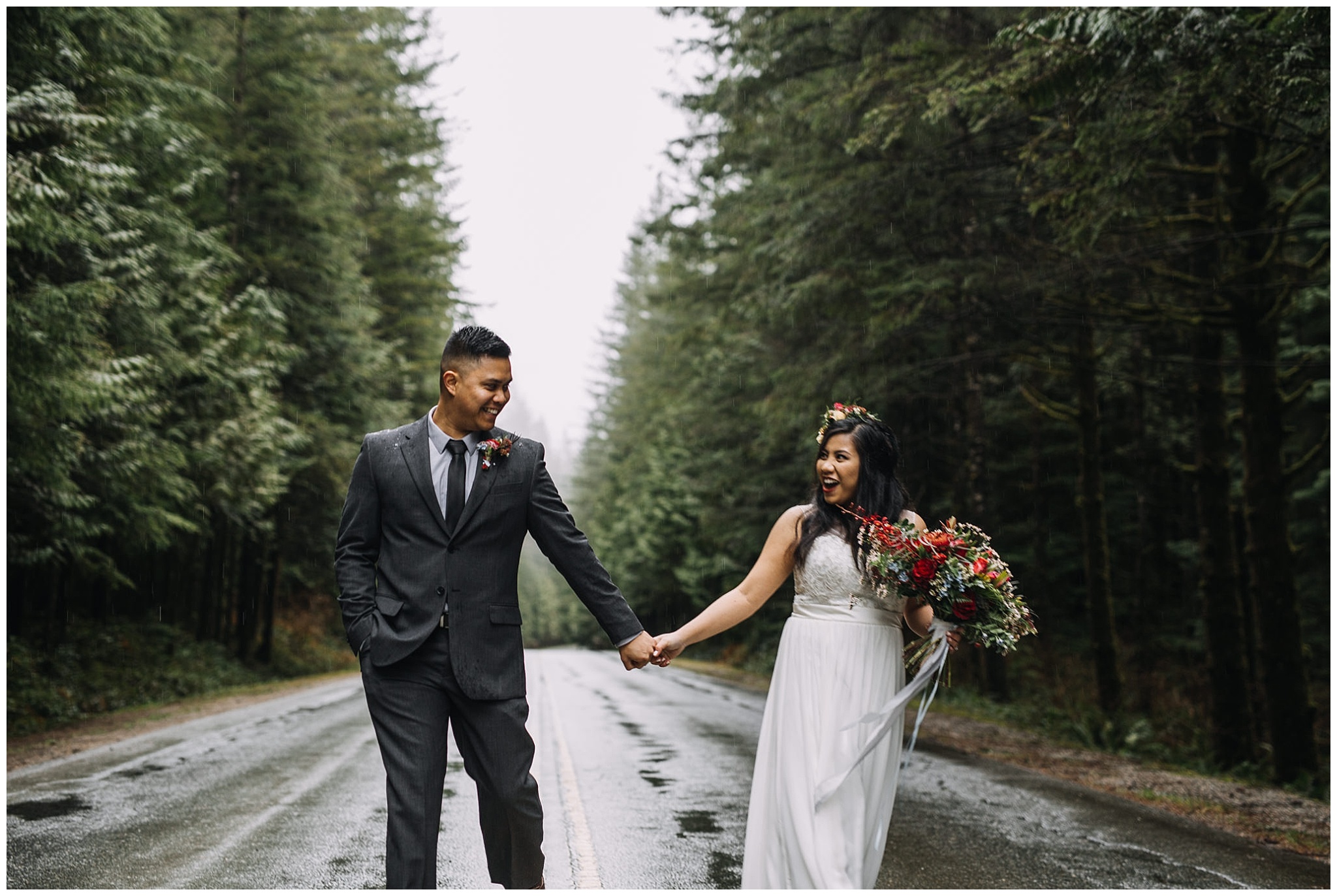 intimate golden ears wedding rainy day bride groom holding hands on road