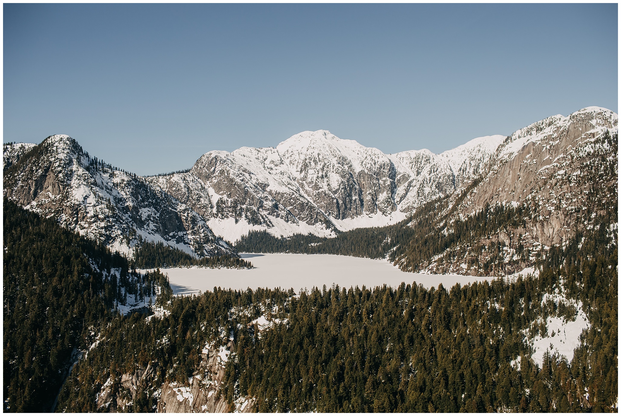 sky helicopters snowy mountain wedding couple portraits
